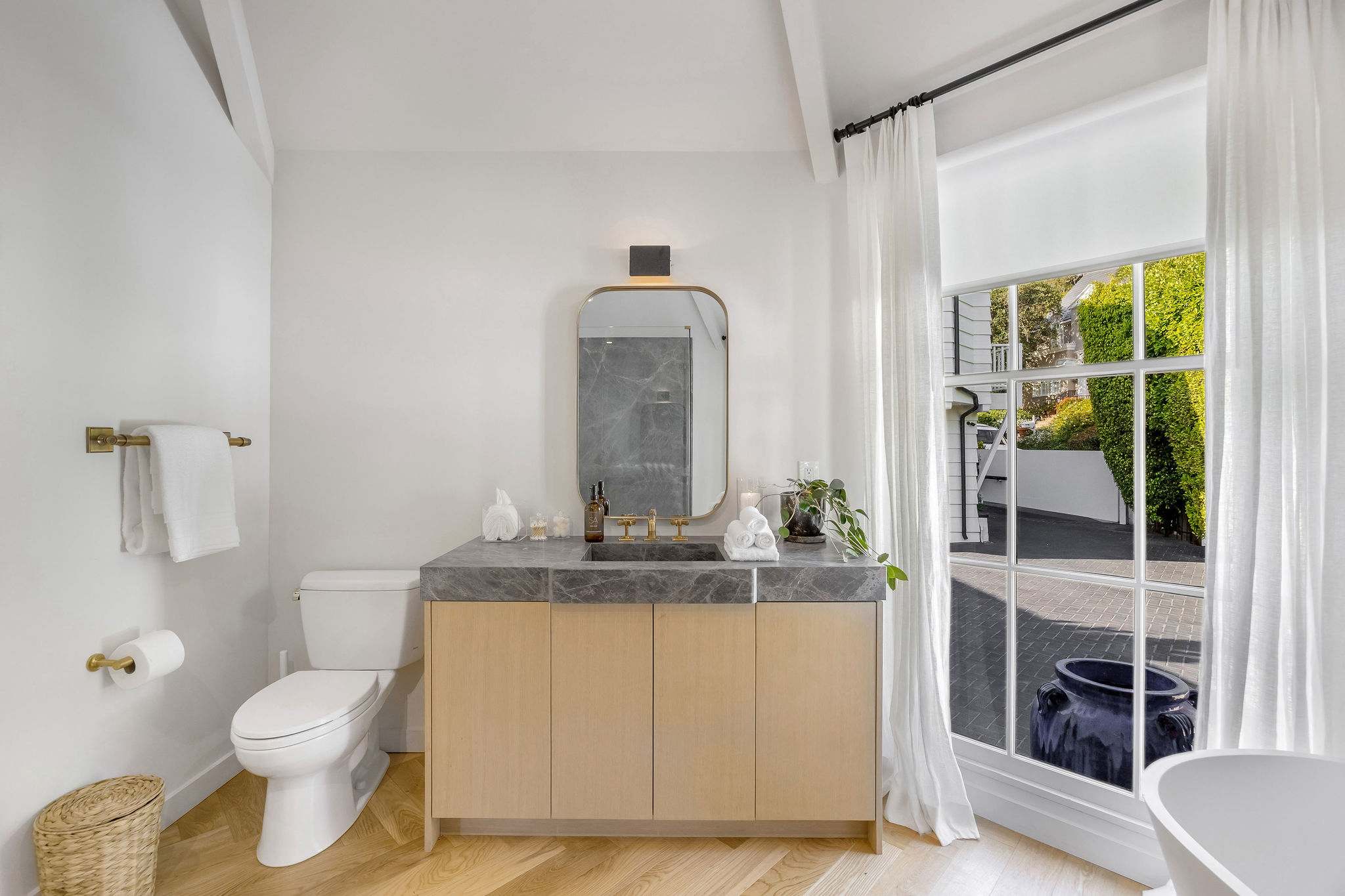 Enjoy timeless finishes and a bright vanity designed for effortless mornings.