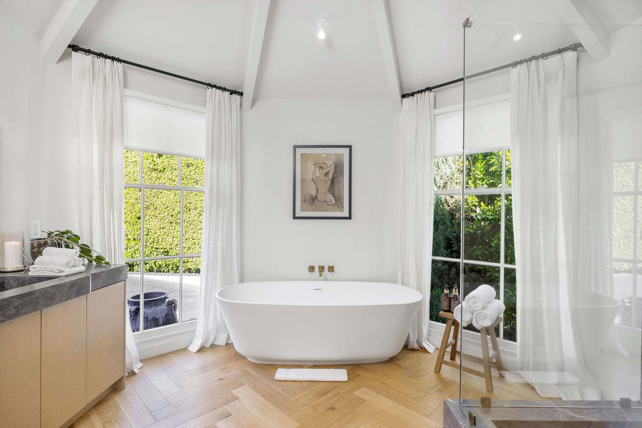 Step beneath floor-to-ceiling marble and start your day feeling refreshed.