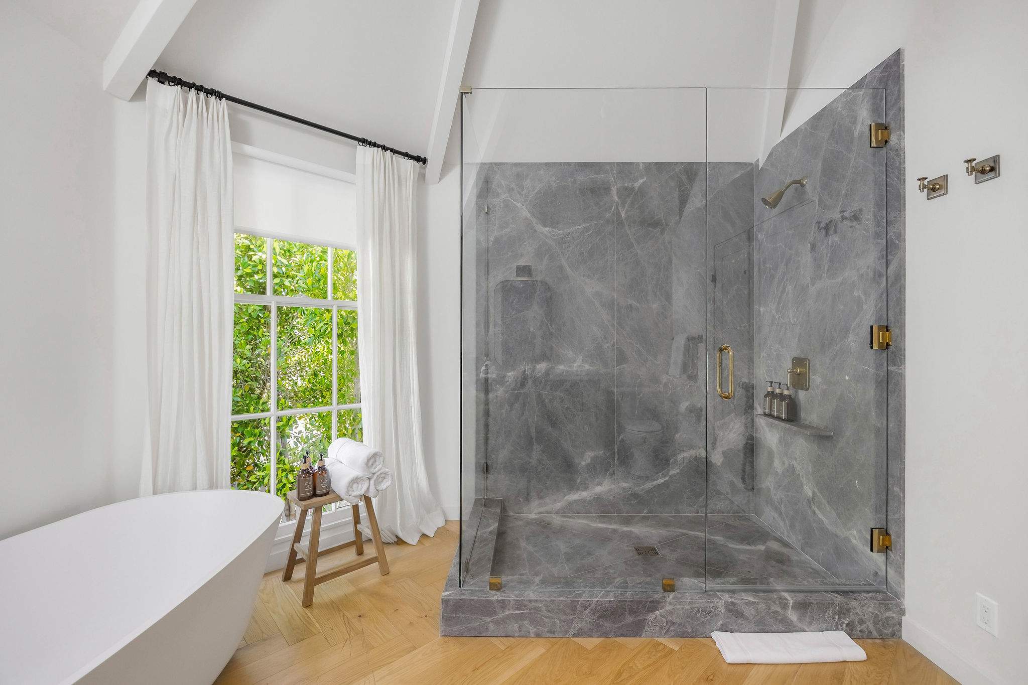 Enjoy timeless finishes and a bright vanity designed for effortless mornings.
