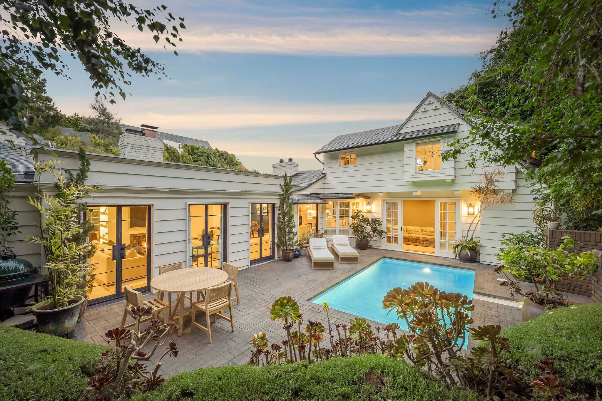 Escape behind the gates to your own hidden retreat in Sunset Plaza.