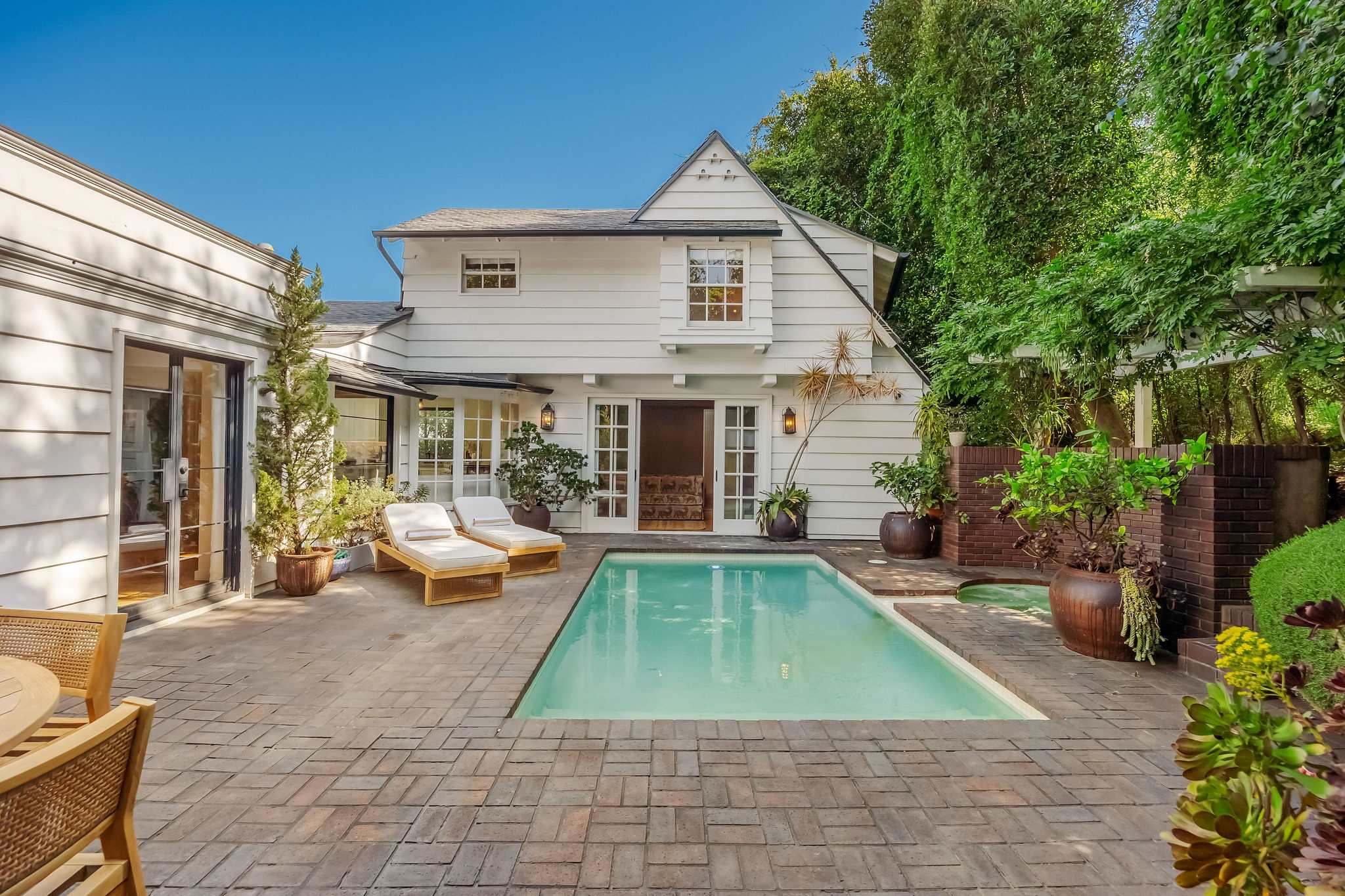 Relax in bright, inviting interiors with timeless architectural charm.