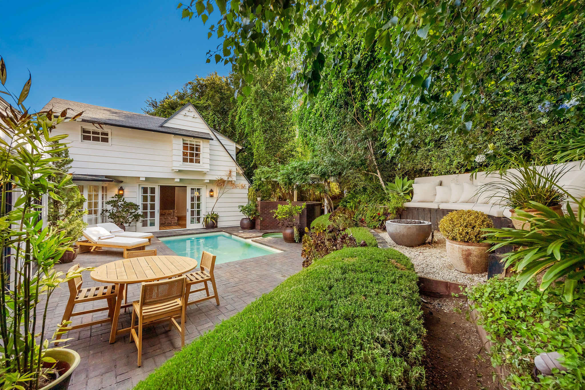 Enjoy indoor-outdoor living in your own hidden Sunset Plaza escape.