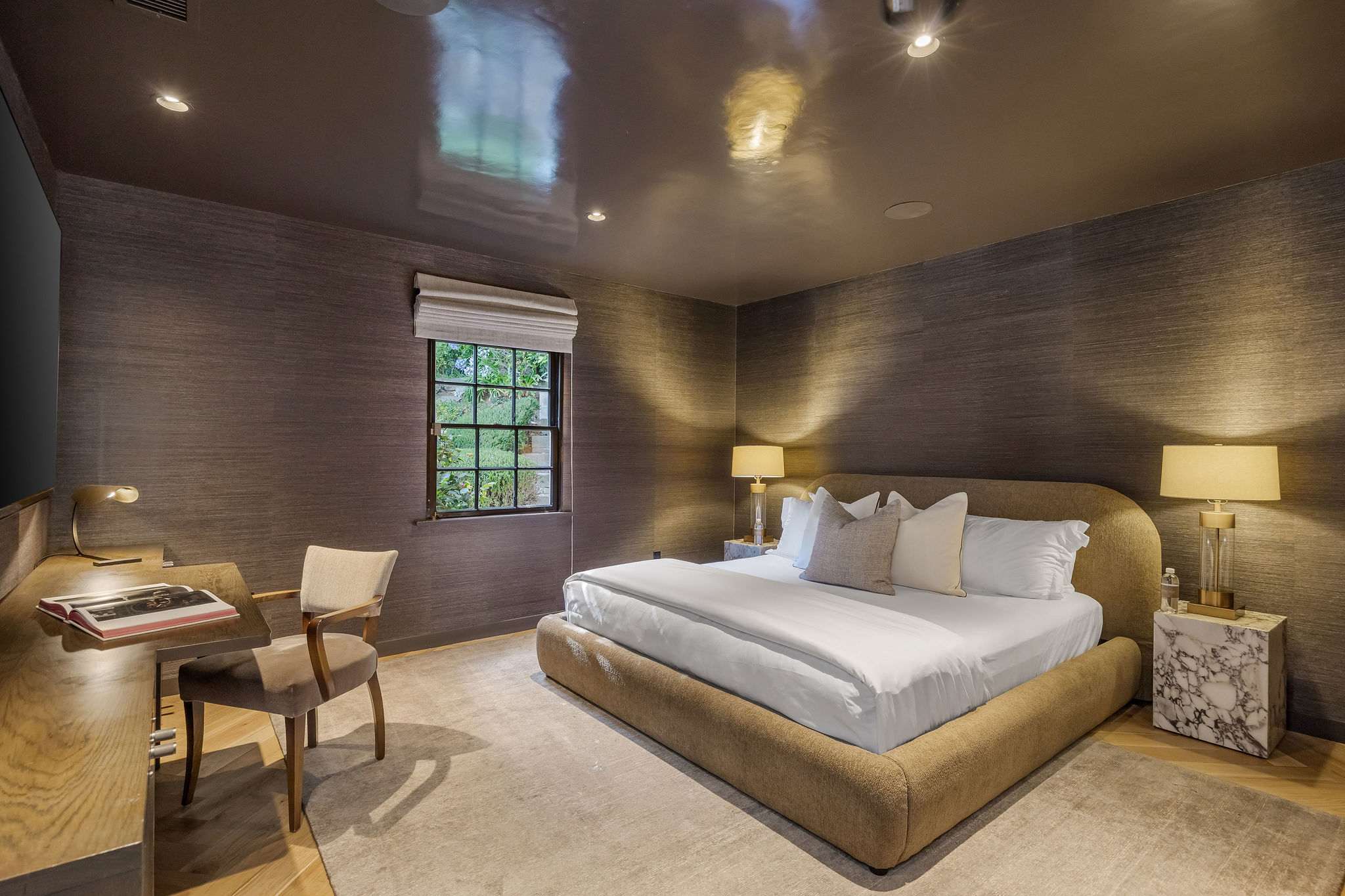 Escape to a moody primary retreat where luxury meets tranquility.