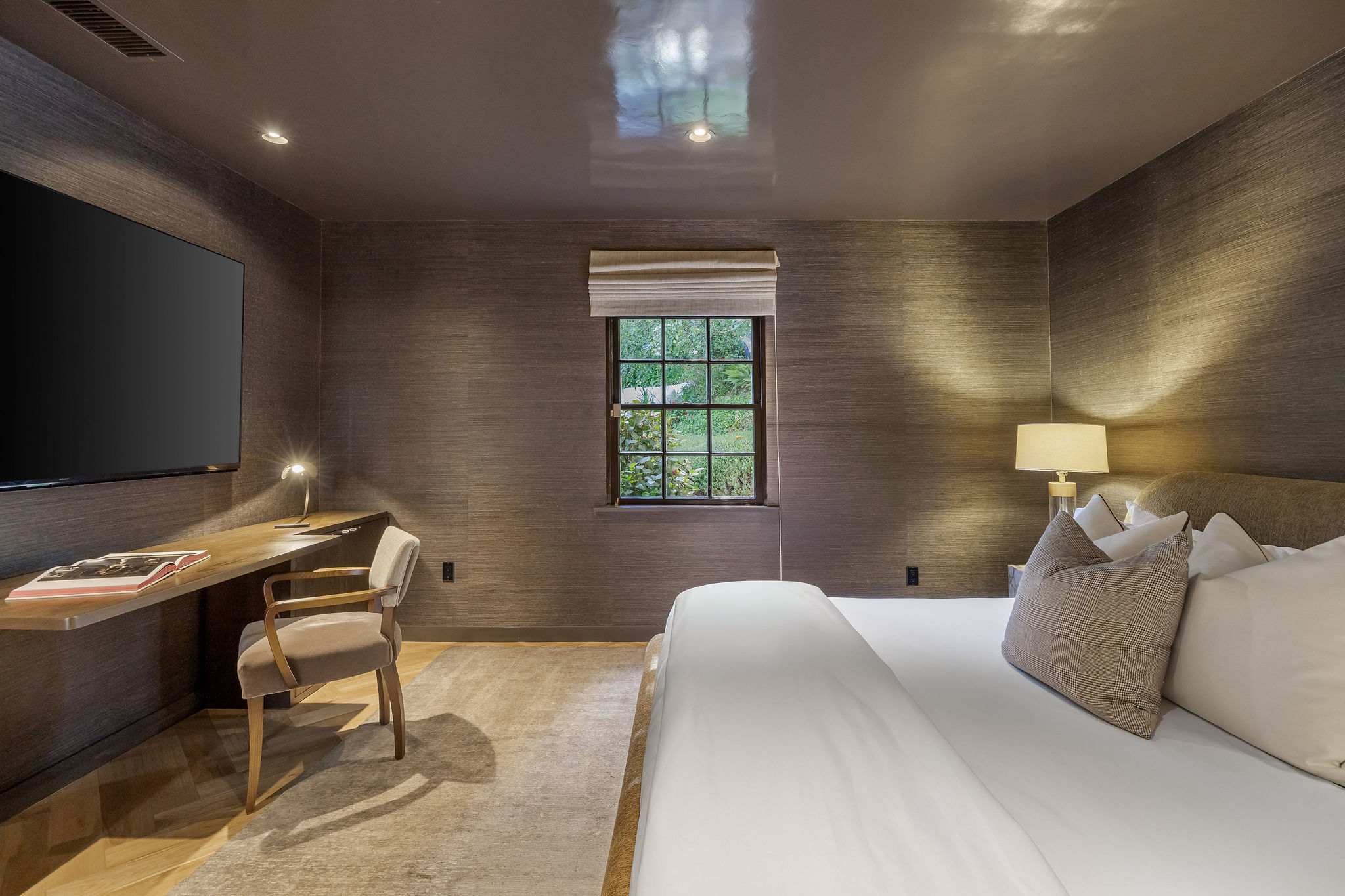 Retreat to a moody primary suite designed for ultimate relaxation.