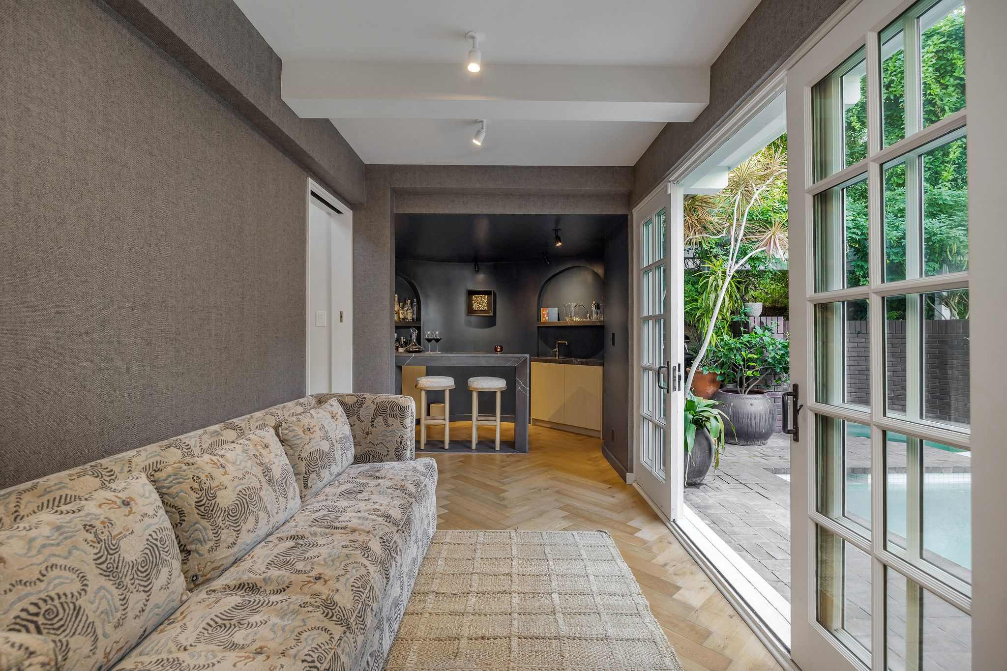 Move effortlessly between cozy interiors and the courtyard beyond.