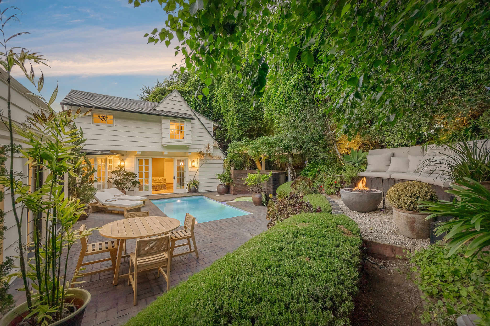 Host unforgettable dinners beneath the trees in your private Sunset Plaza courtyard.