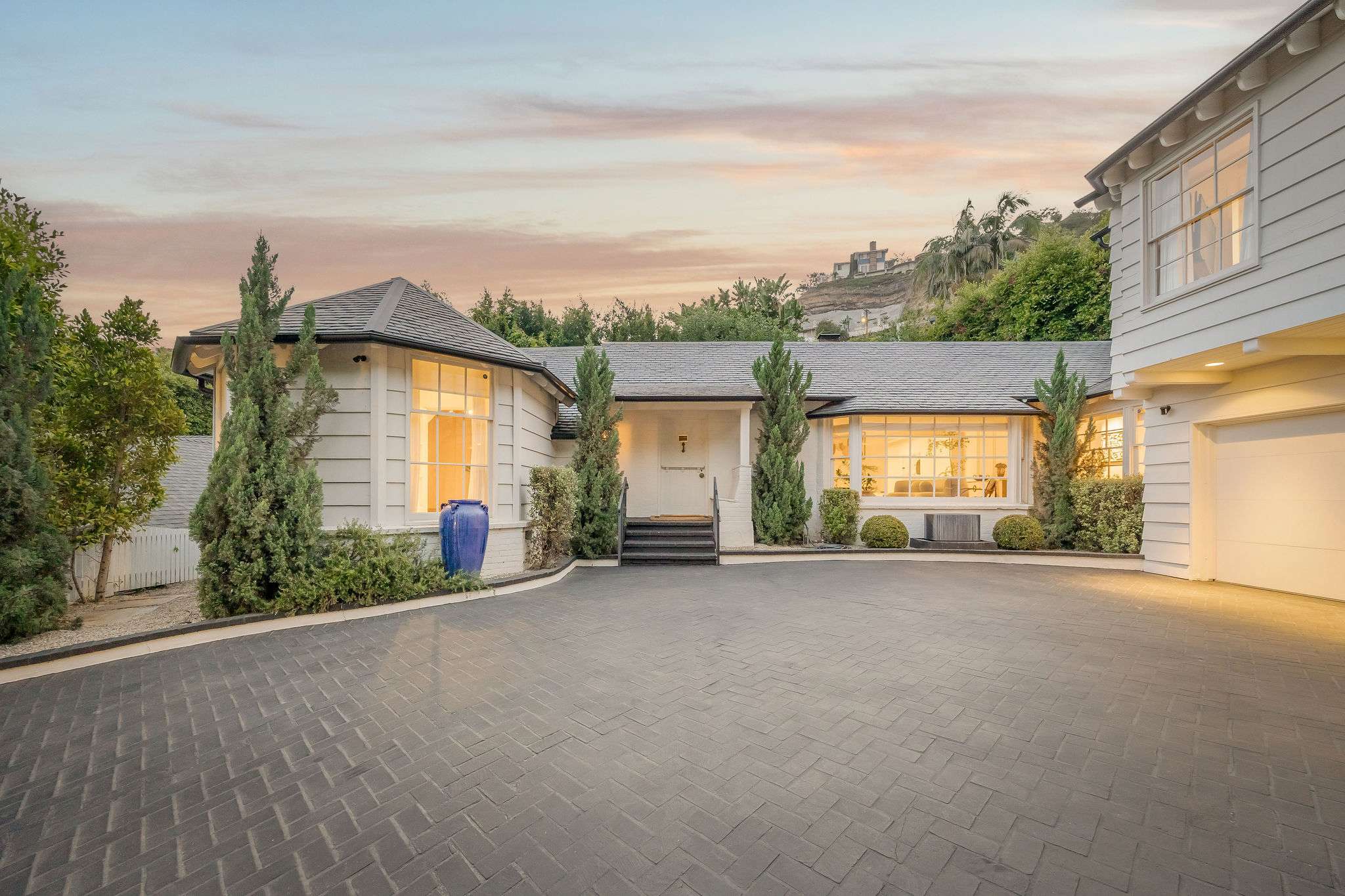 Arrive in style with a gated motor court and parking for five vehicles.