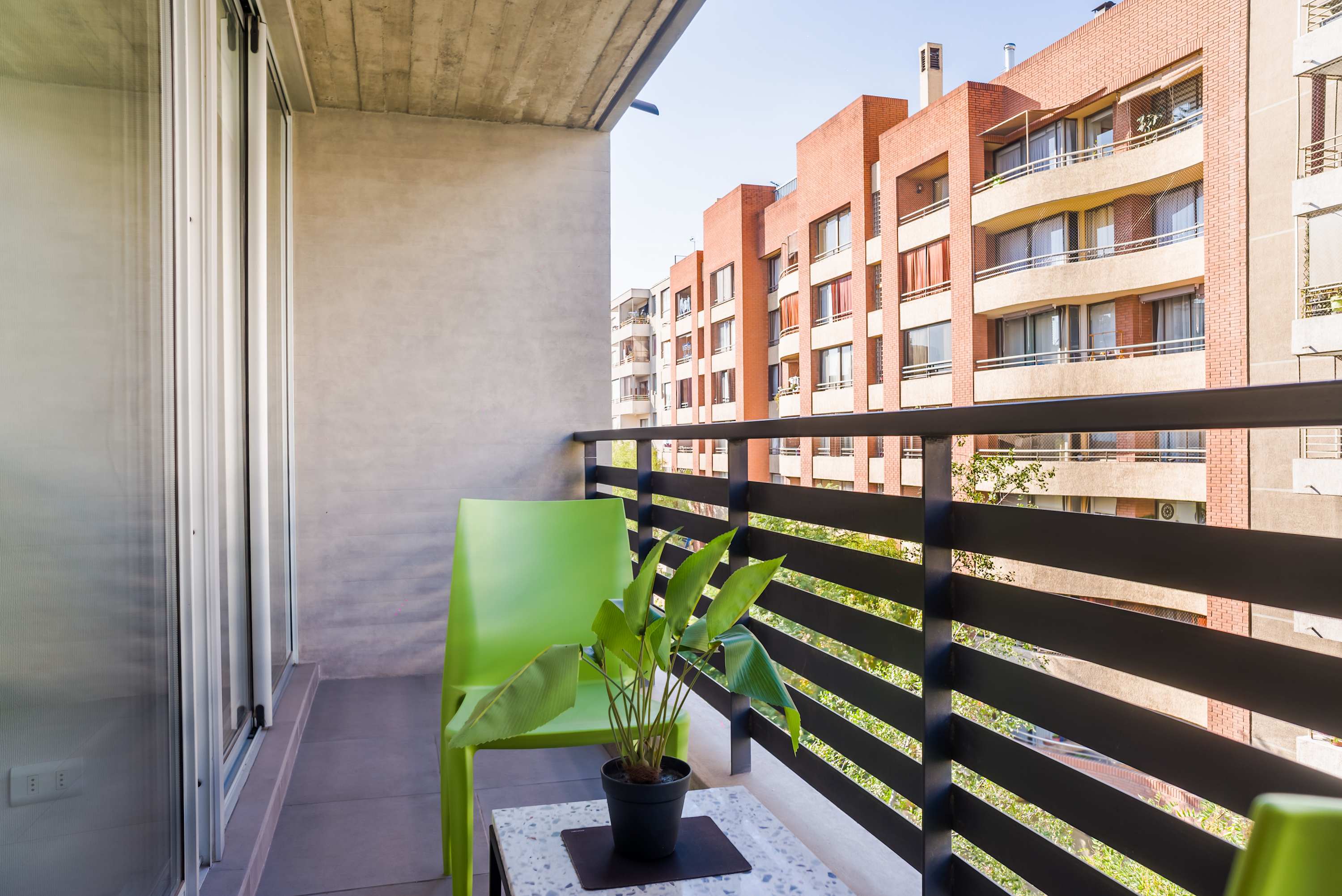 Relax on your private balcony with a refreshing view of the cityscape, perfect for morning coffee or evening unwinding.