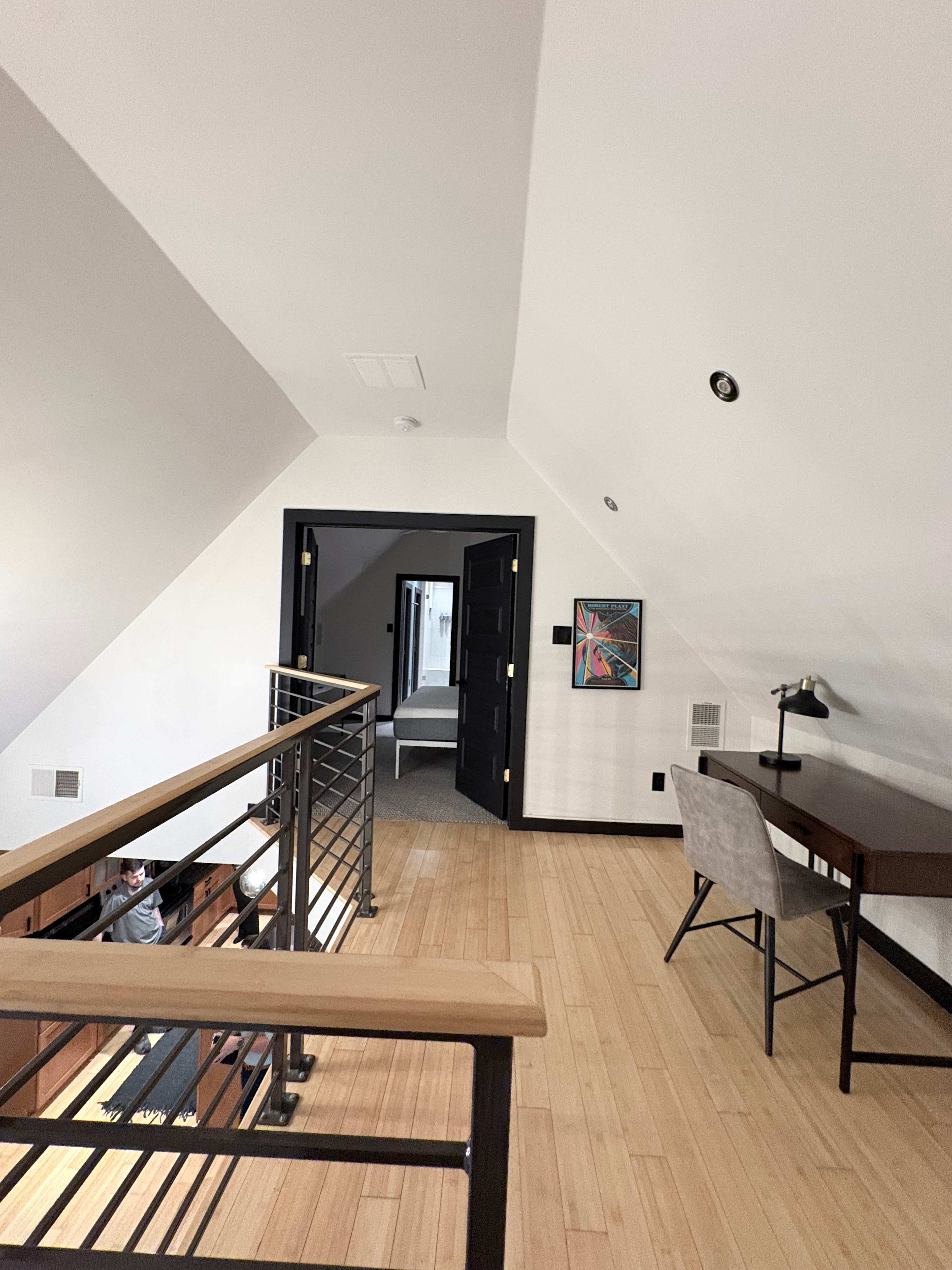Cozy loft space with a workspace, perfect for relaxation or productivity.