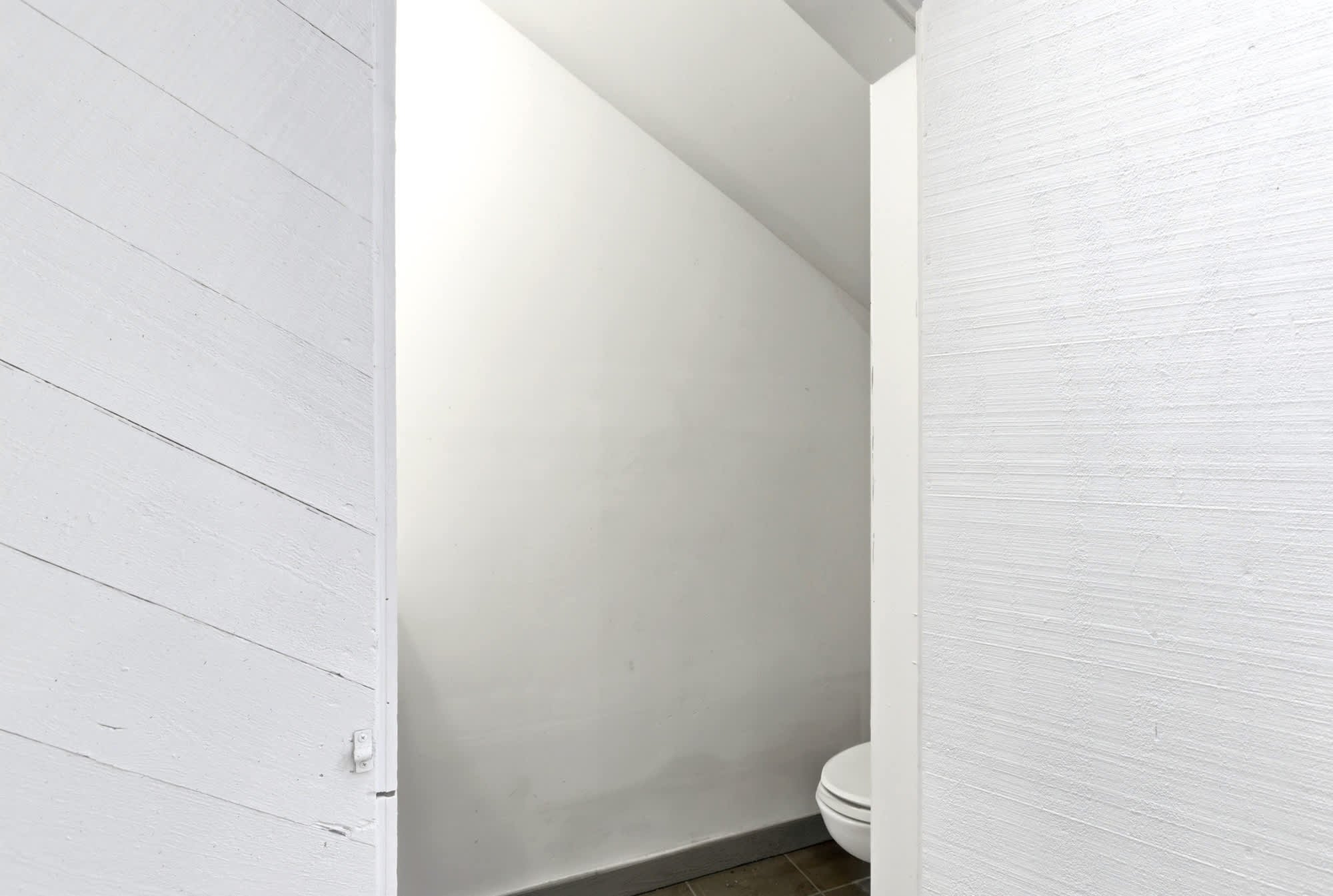 A convenient pool-side bathroom keeps sandy feet from tracking inside — a practical touch that makes pool days truly seamless.