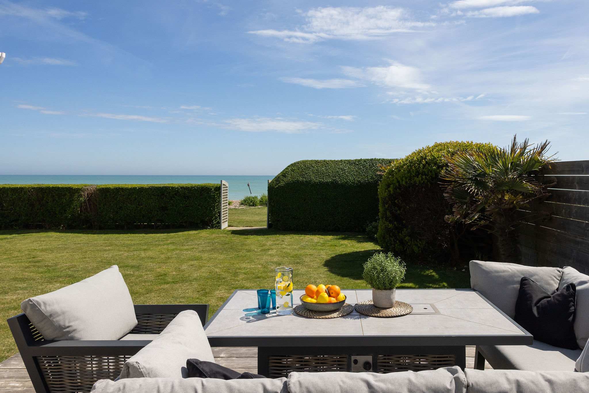 Outdoor lounge area with gas BBQ.