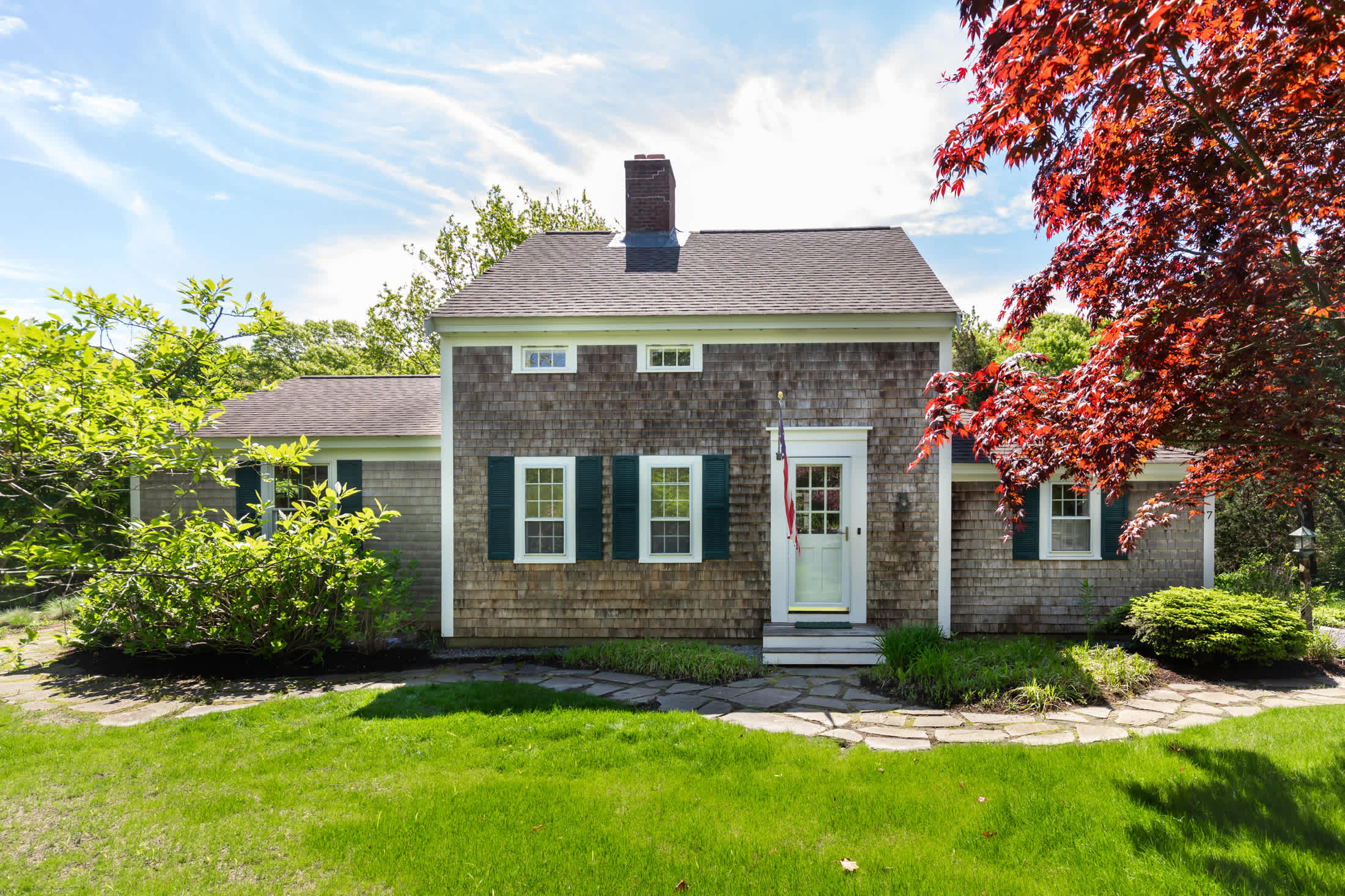 A look at the home's exterior - sunny and welcoming for groups of families and friends.