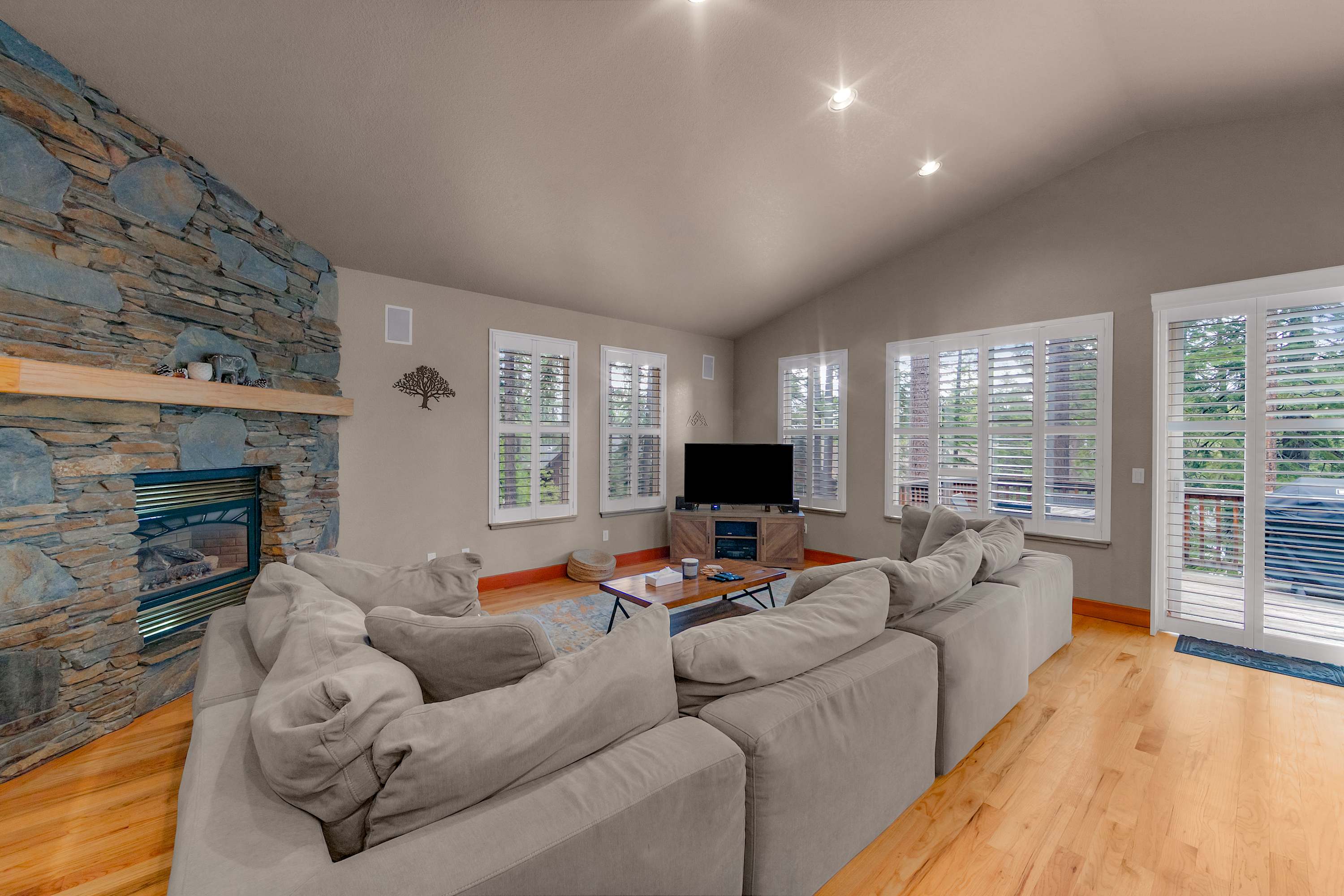 Sink into cozy couches, stream your favorites, and unwind in this inviting open living space