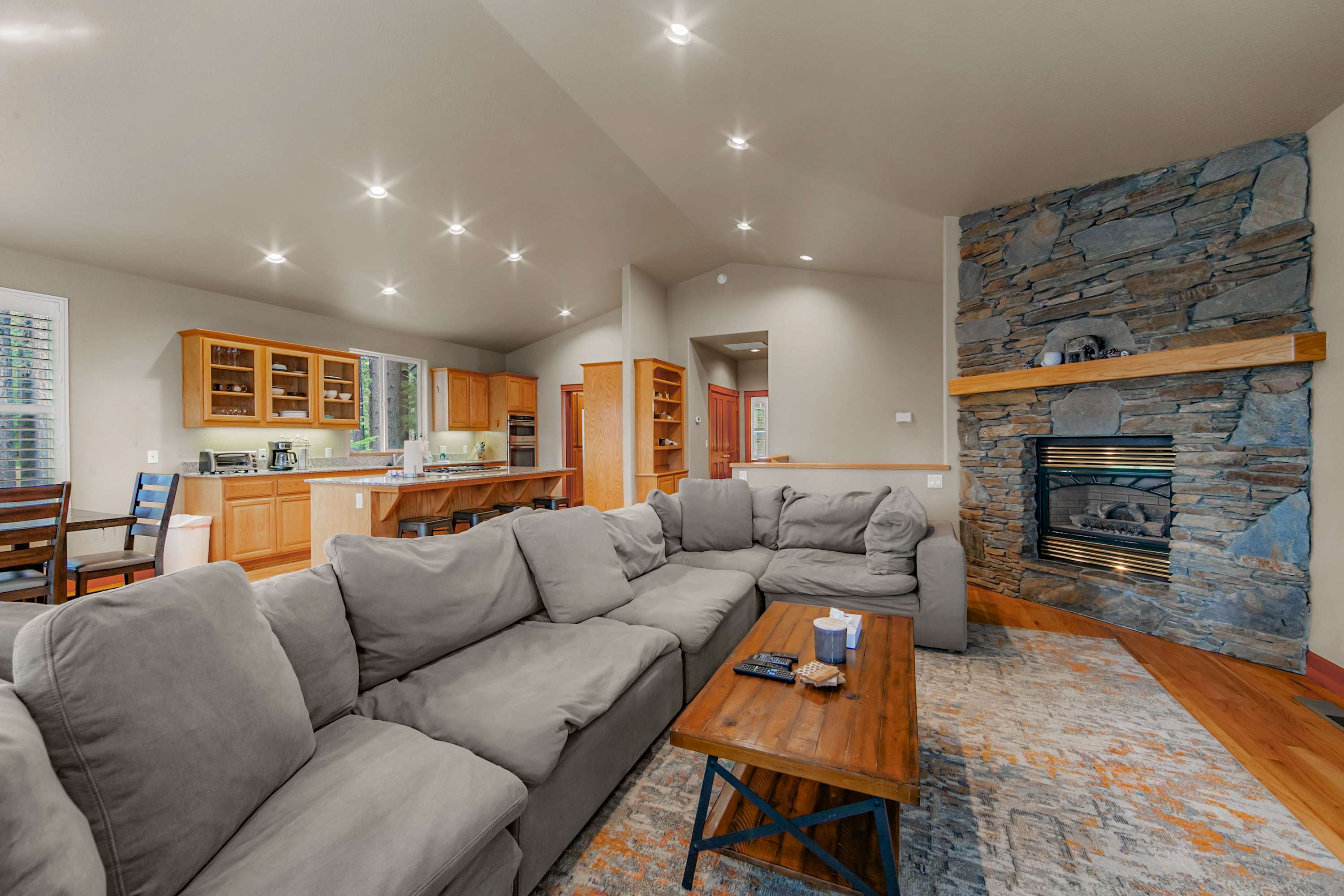Sink into cozy couches, stream your favorites, and unwind in this inviting open living space
