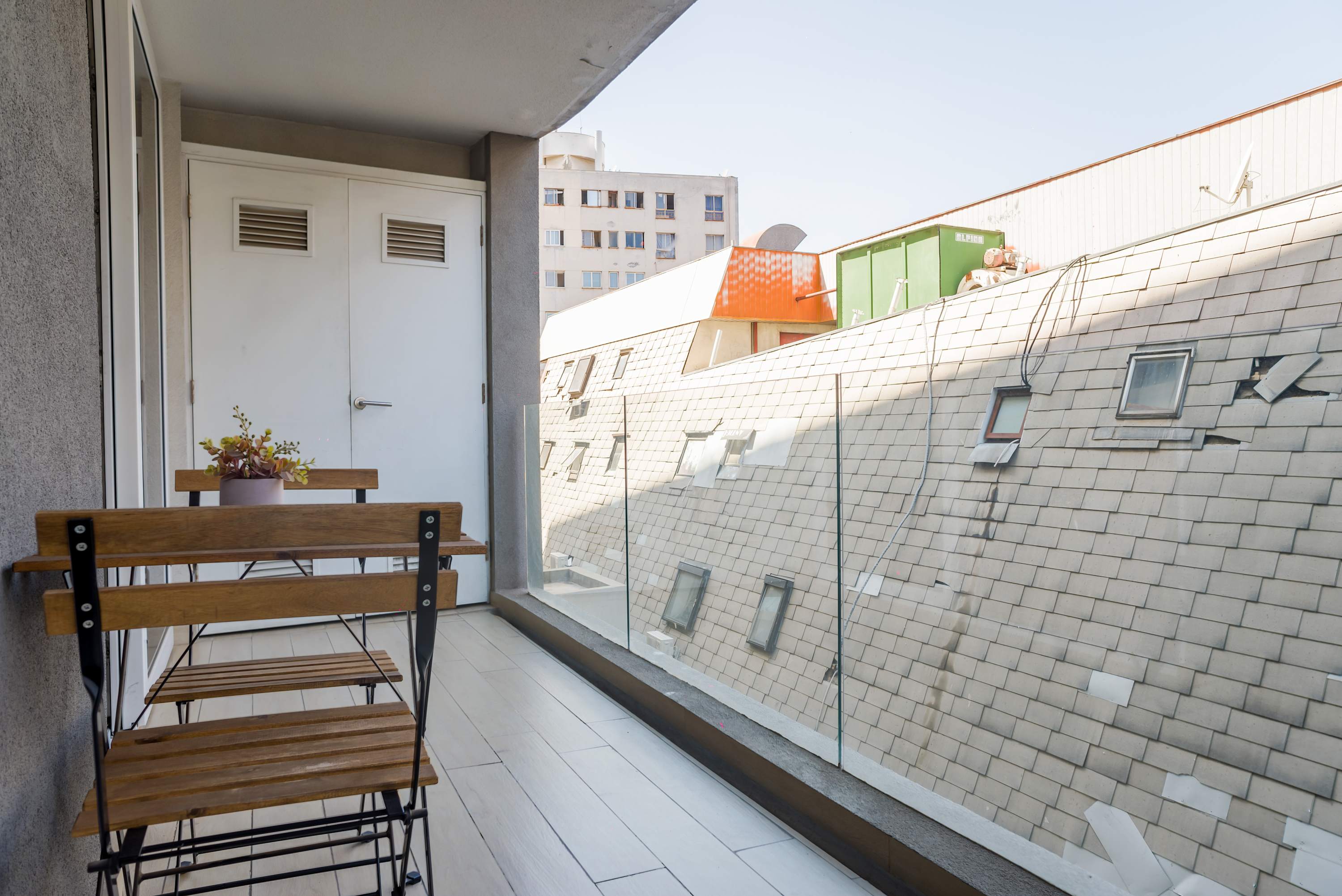 Relax on the private balcony with a morning coffee and enjoy charming city views.