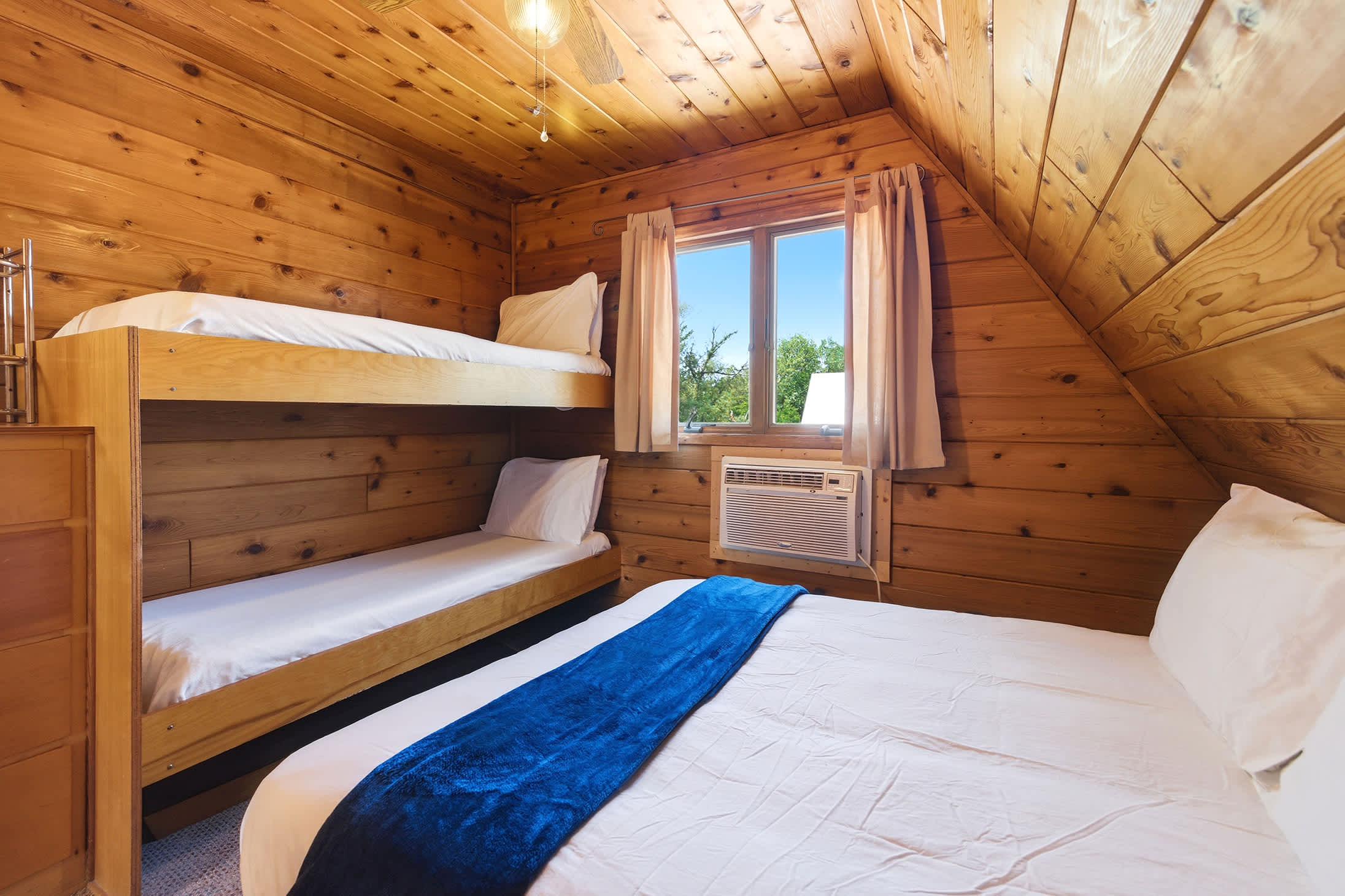 Bedroom 1 is on the 2nd floor and has a queen and single bunk bed.