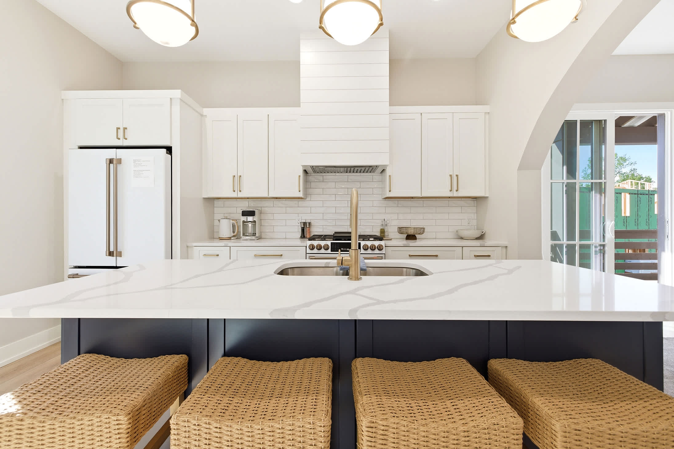 An oversized island keeps cooking, dining, and conversation connected.