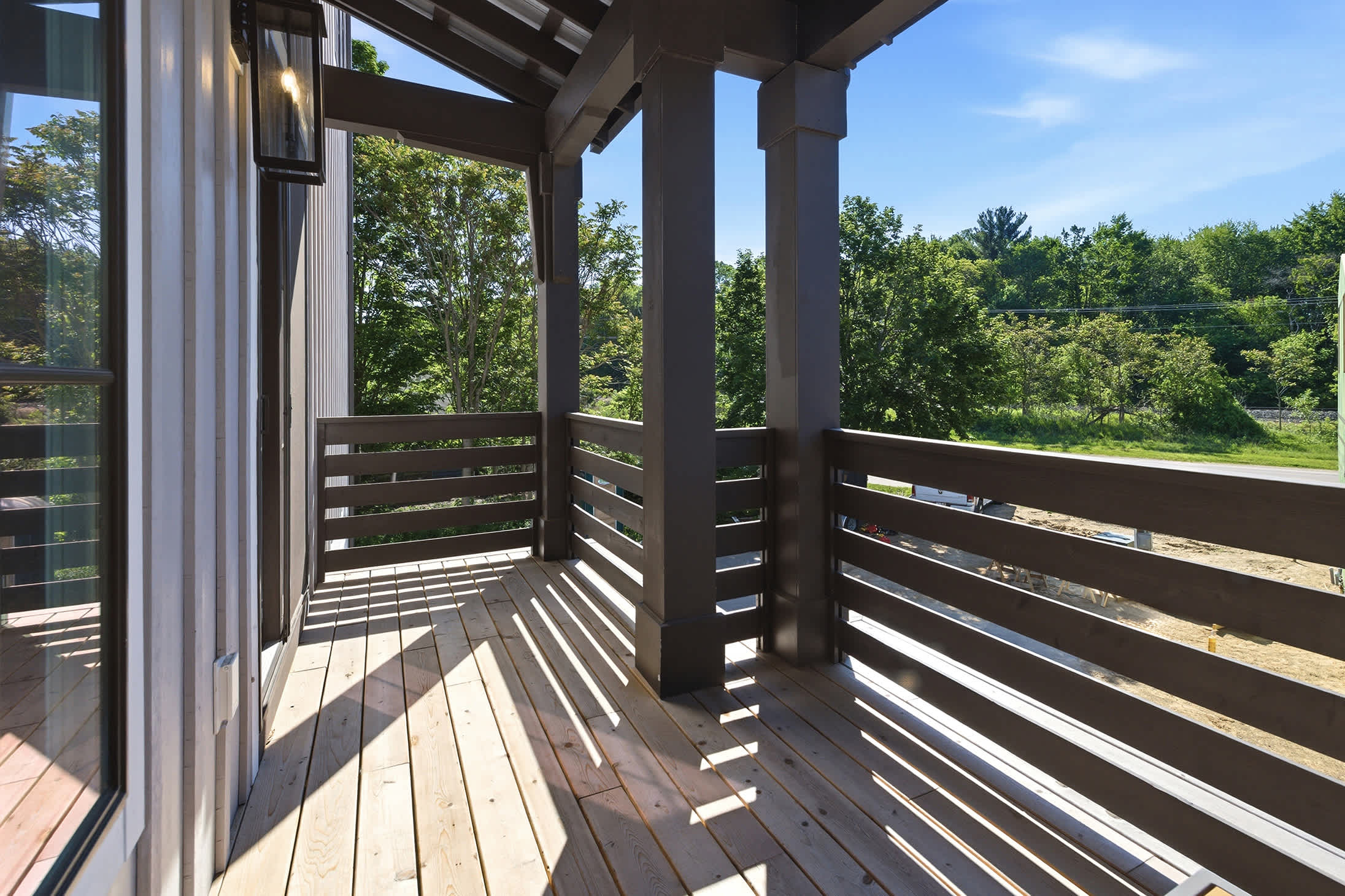 Enjoy fresh air and treetop views from your private balcony.