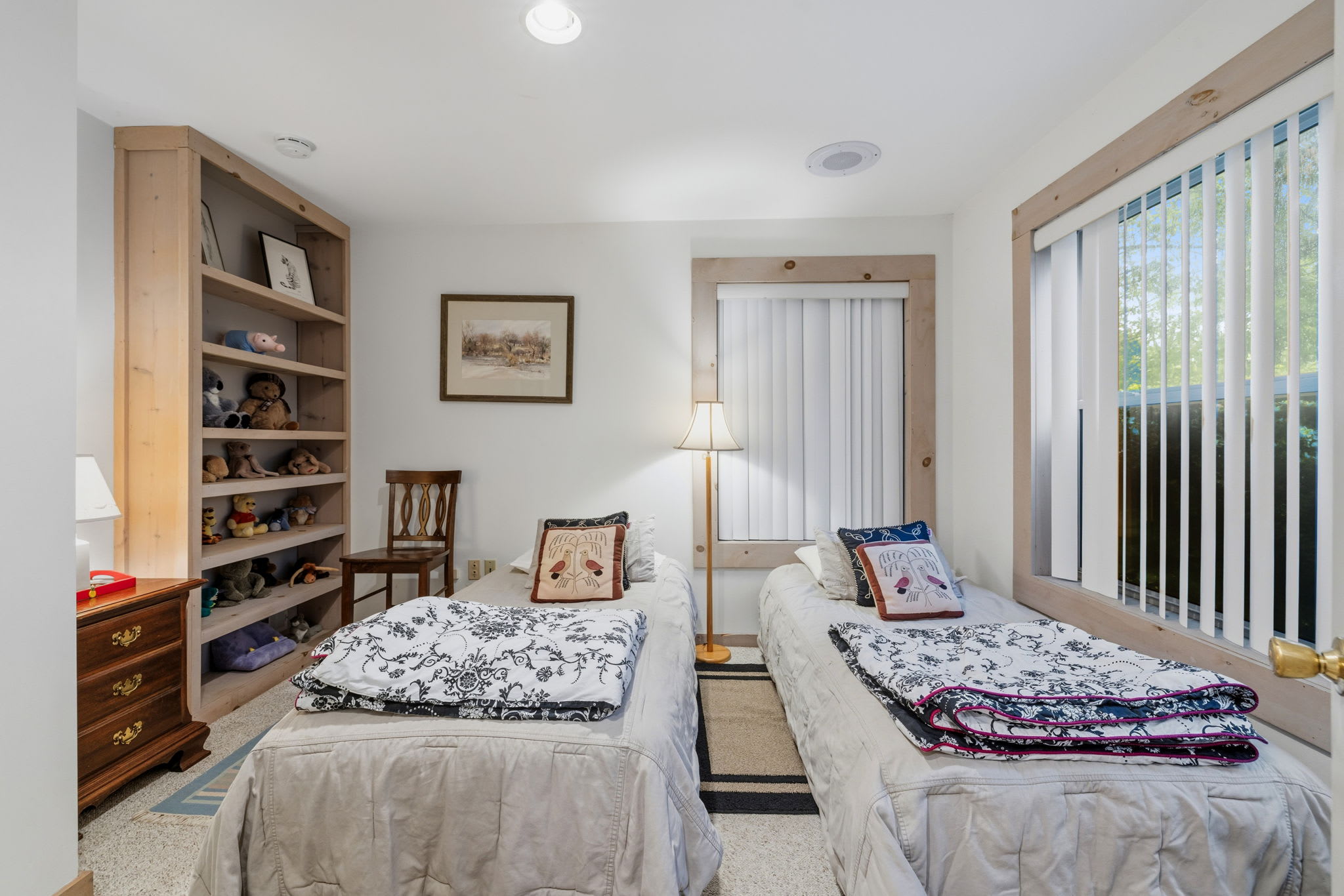 A cozy room that's perfect for children or additional guests. Two twin beds and convenient access to shared bathroom