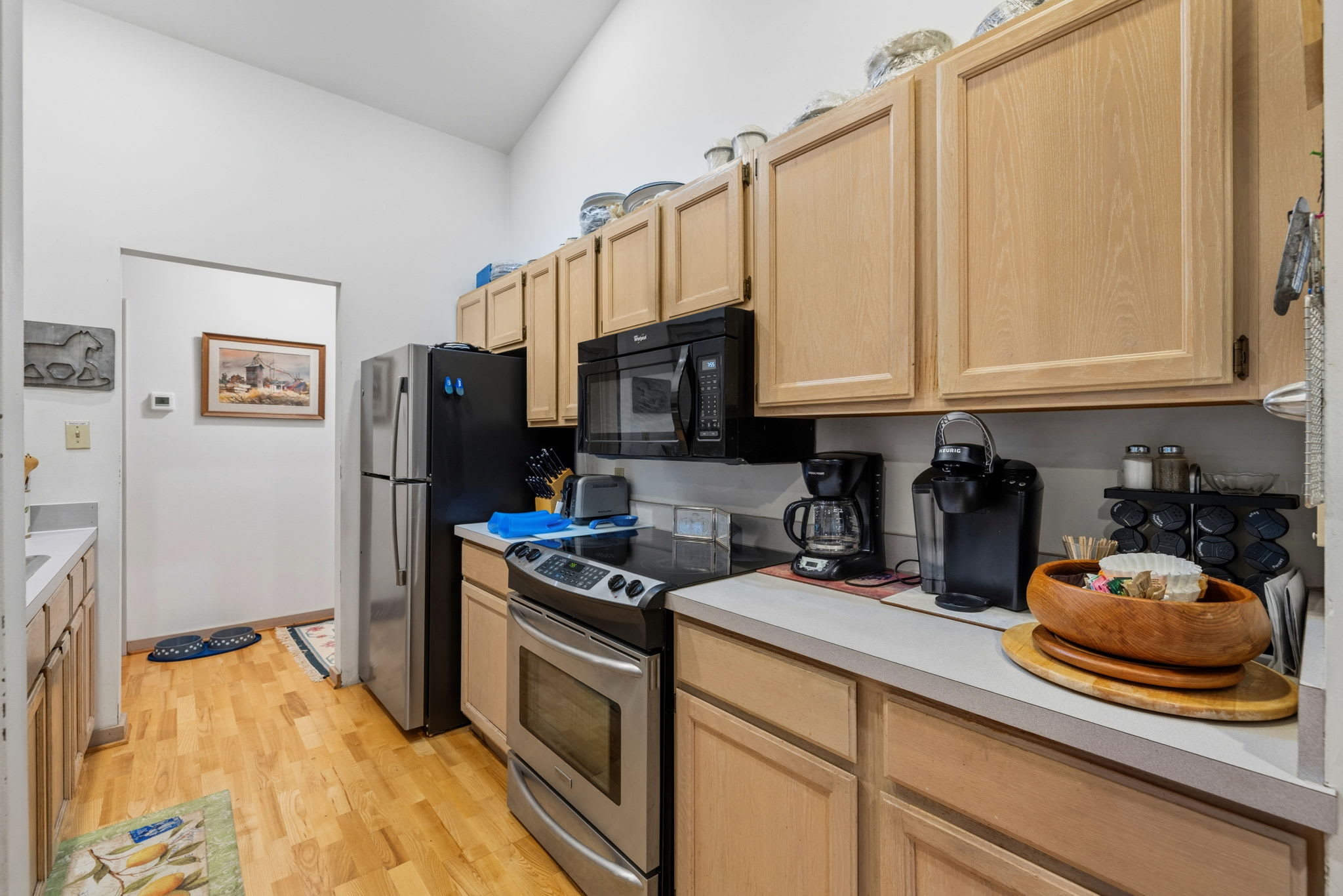 The fully equipped kitchen has everything needed for preparing meals, morning coffee, and gathering with family and friends.