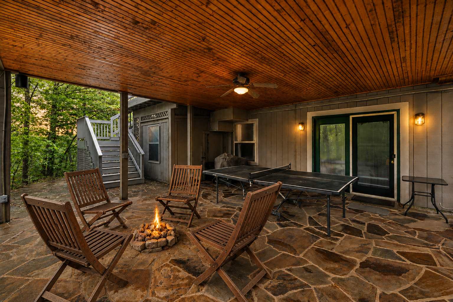 Covered patio with ping pong table and fire pit