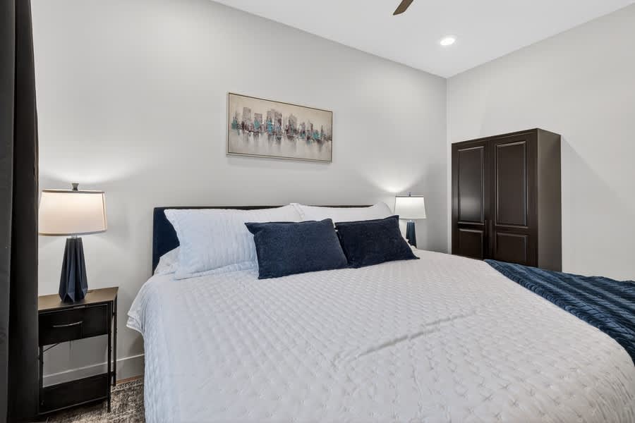 Lower unit: Bedroom 1- King size bed, TV, and Ceiling Fan