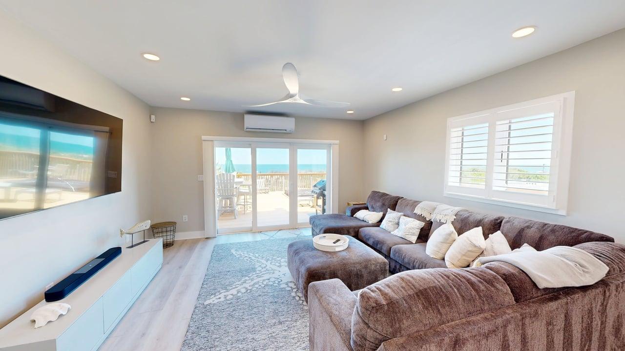 Luxurious oceanfront townhome with private deck and panoramic coastal views