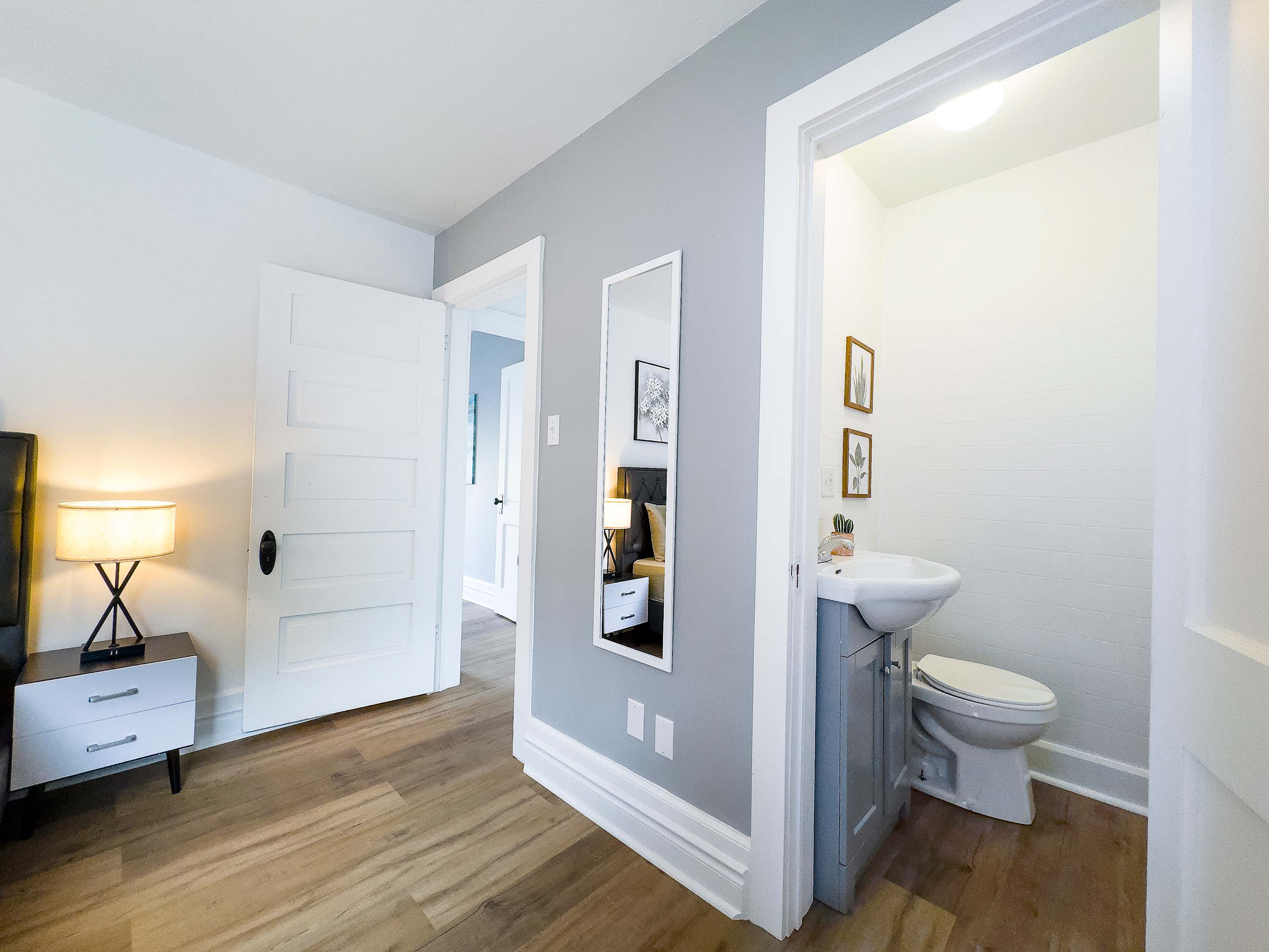 Primary Bedroom with Queen Size Bed and Half-Bathroom Ensuite