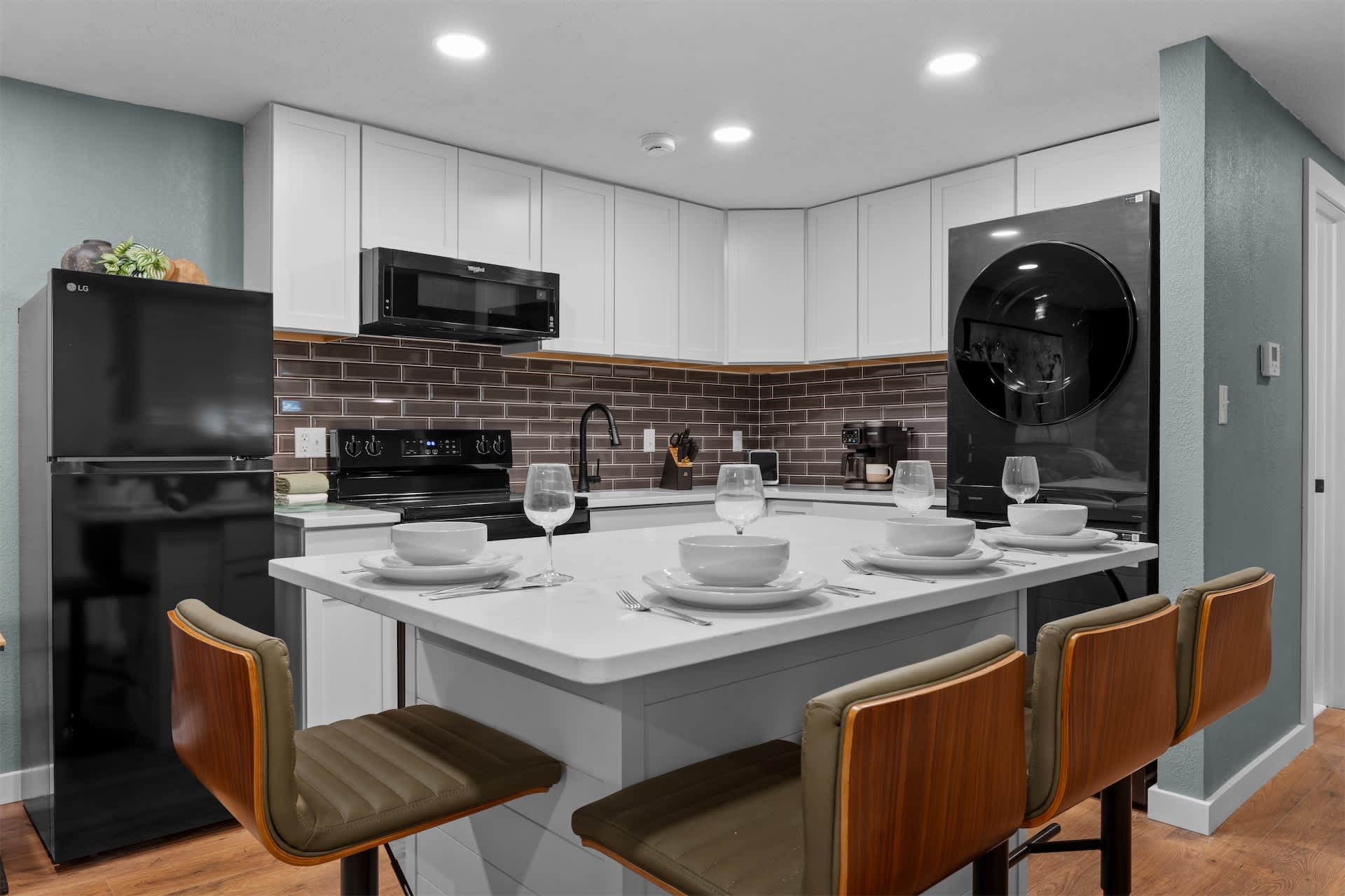 The chic, open kitchen offers ample space & all the comforts of home​