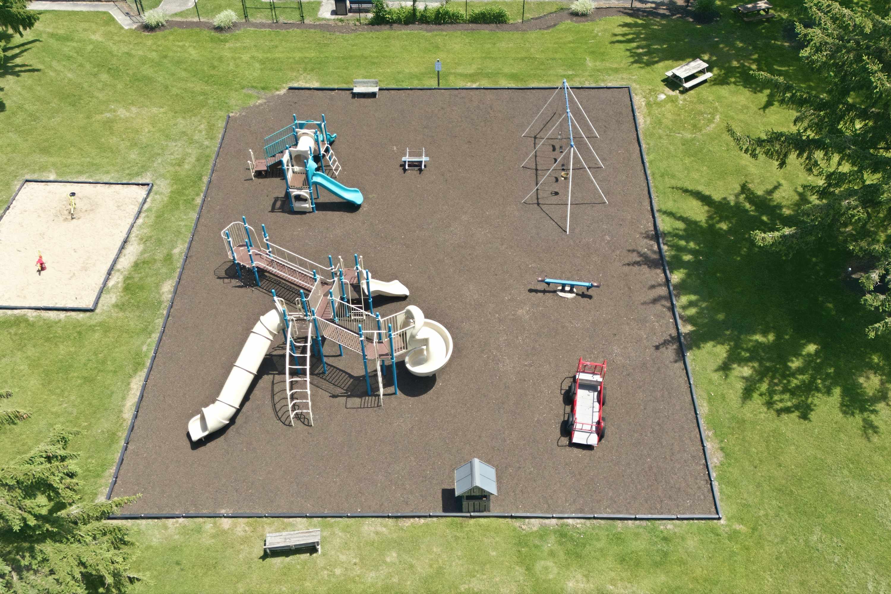 Let the kids play on slides, climbers, and a sandbox!