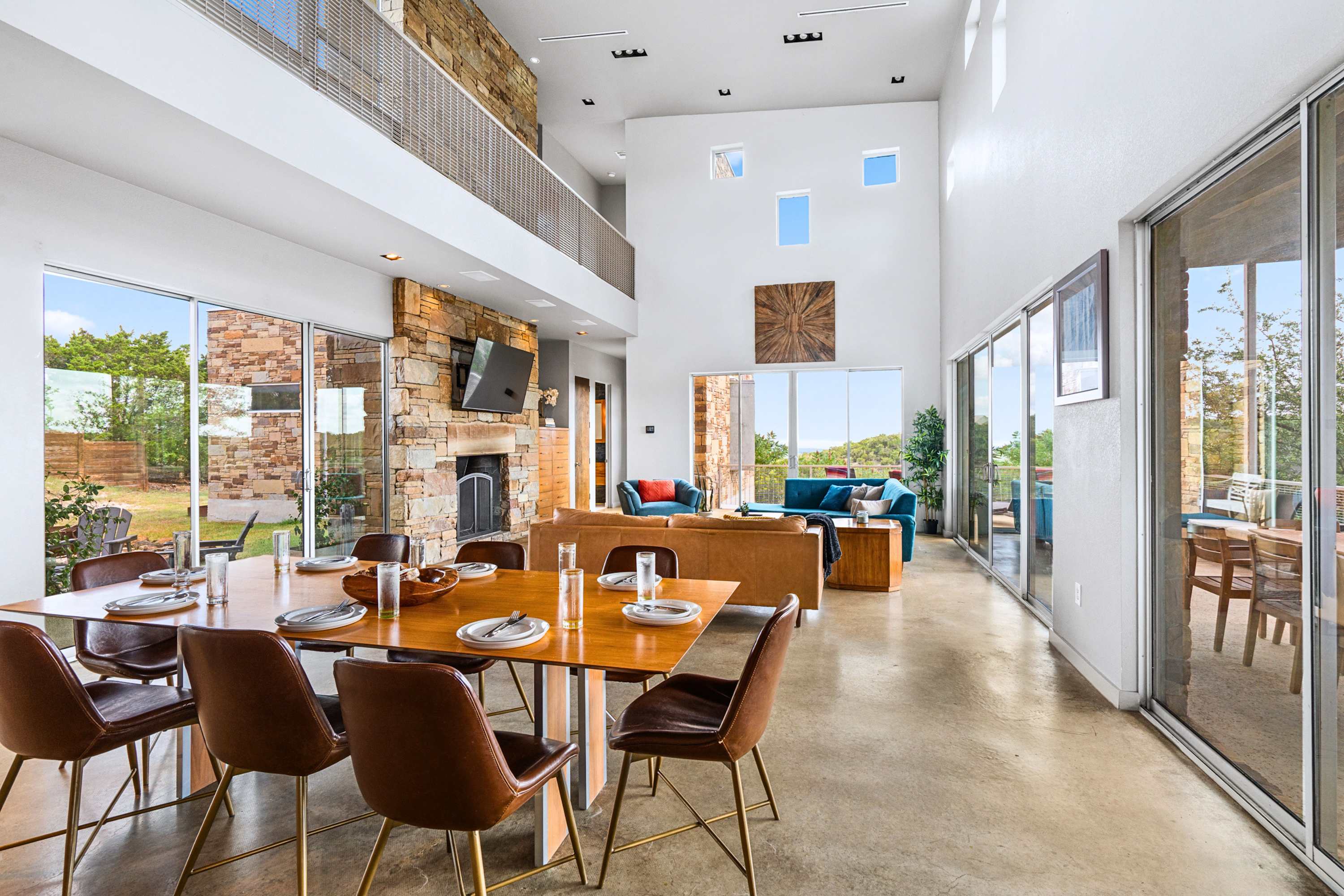 Bright dining space surrounded by floor-to-ceiling windows