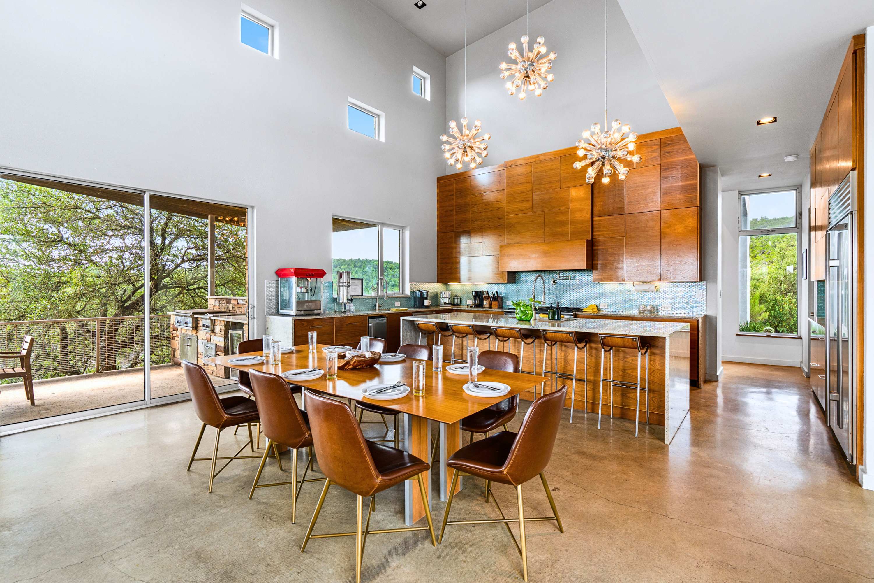 Flow seamlessly from gourmet cooking to elegant dining in this grand open space