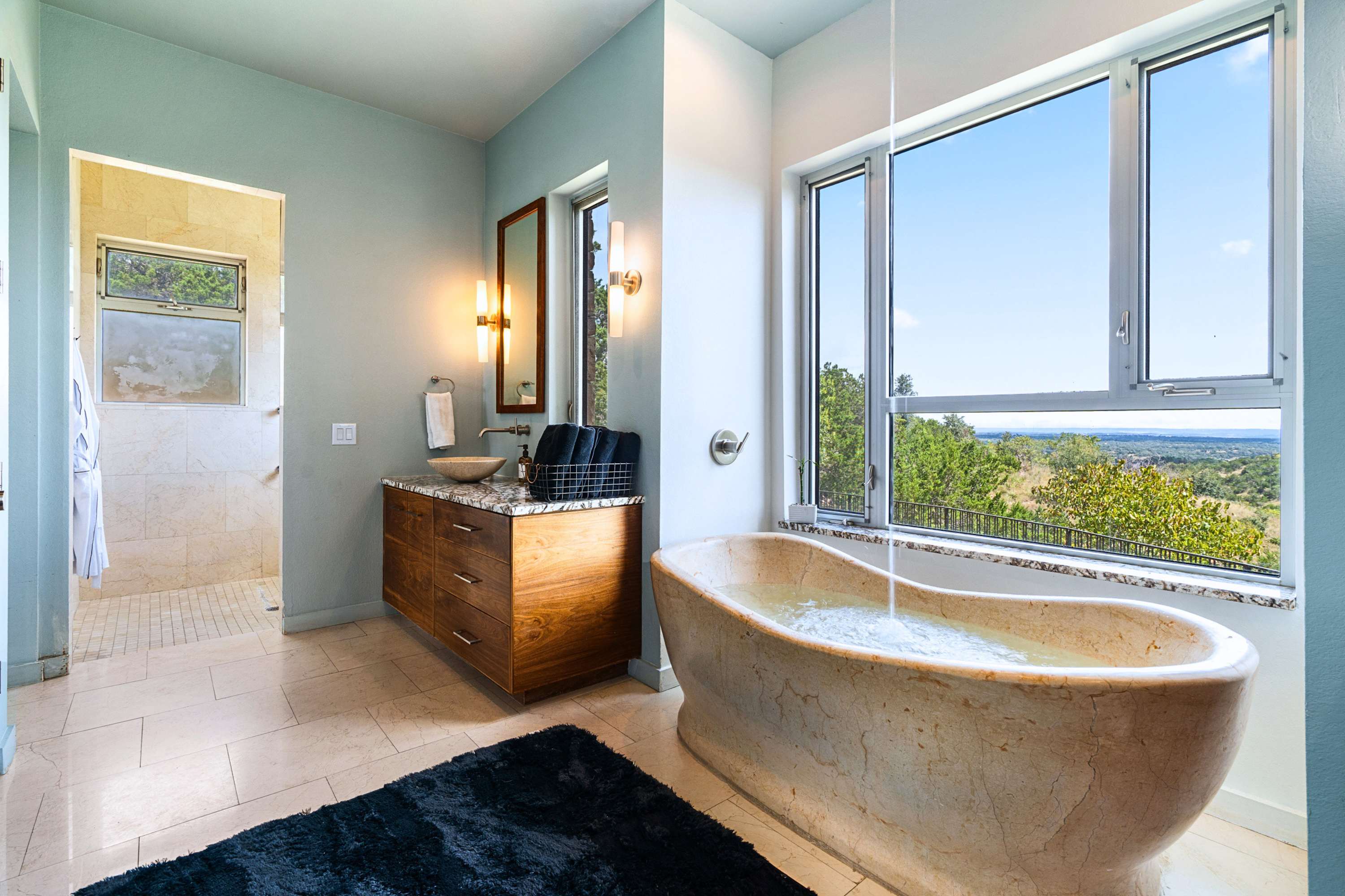 Spa-style bathtub with modern finishes and panoramic view