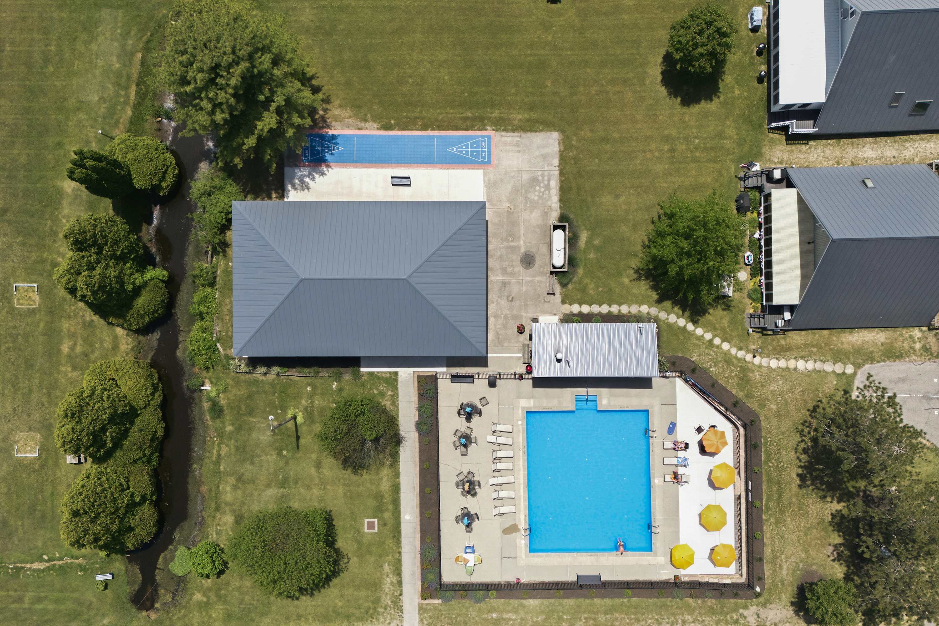 Swim, lounge, and play shuffleboard — all just steps from your chalet.