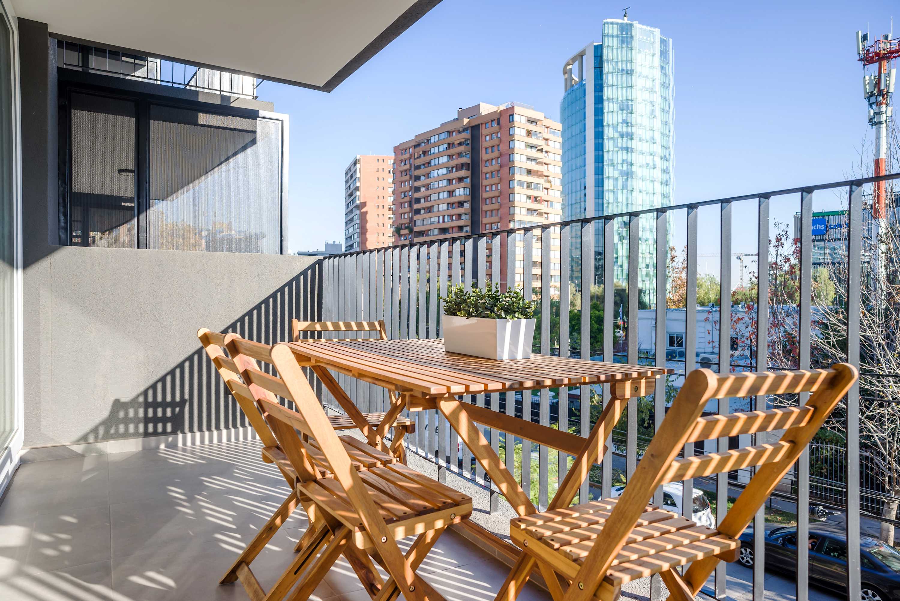 Enjoy your morning coffee with a stunning city view from this private balcony, perfect for relaxation and taking in the vibrant surroundings.