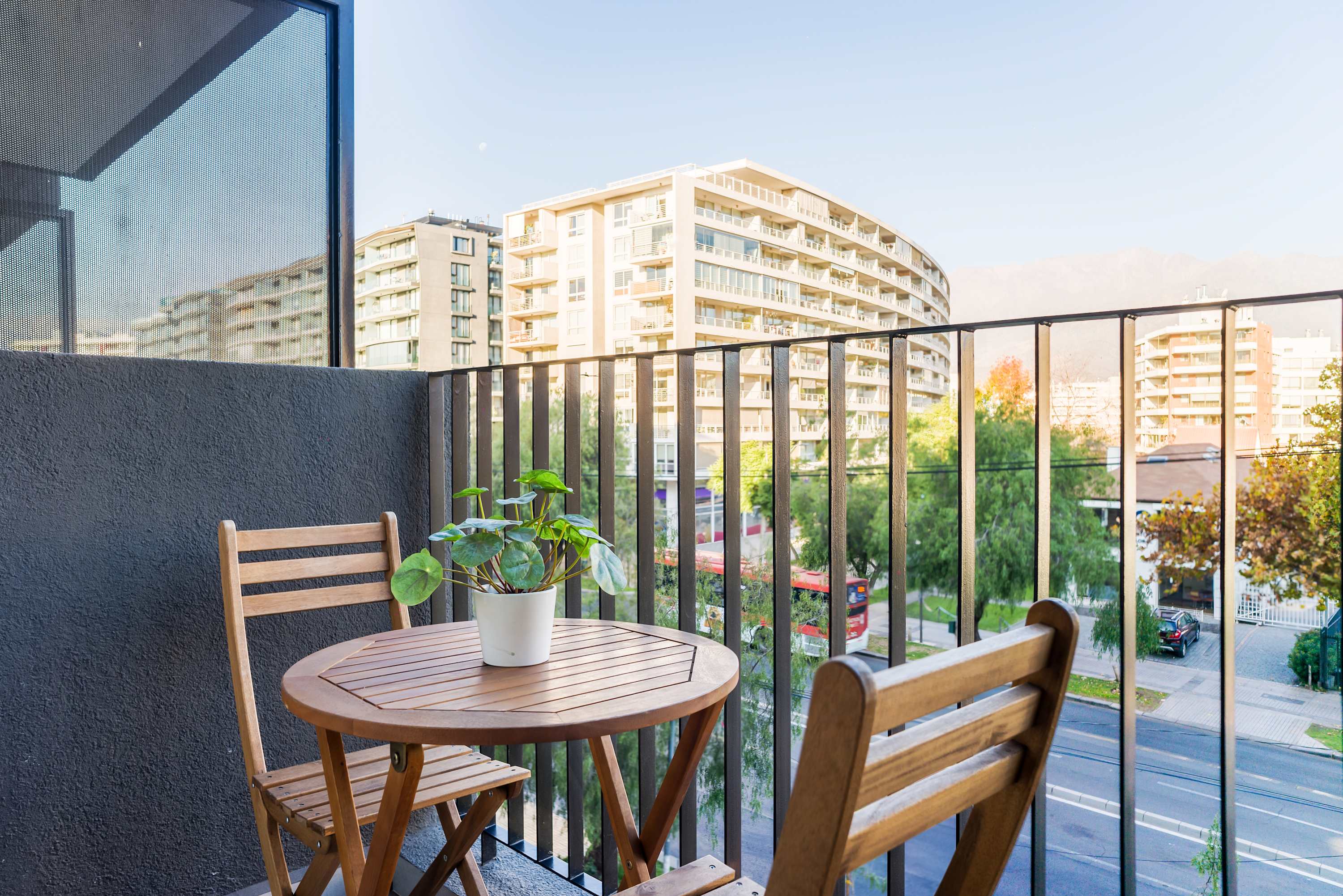 Enjoy your morning coffee on this charming balcony with city views, perfect for relaxation.