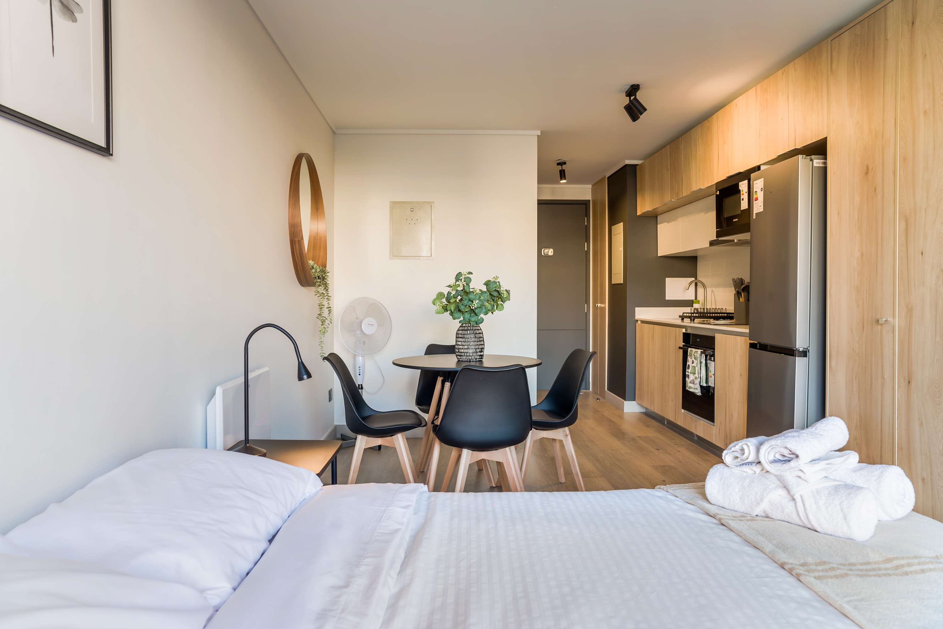 Cozy studio with modern amenities and a stylish dining area, perfect for a comfortable stay in the heart of the city.