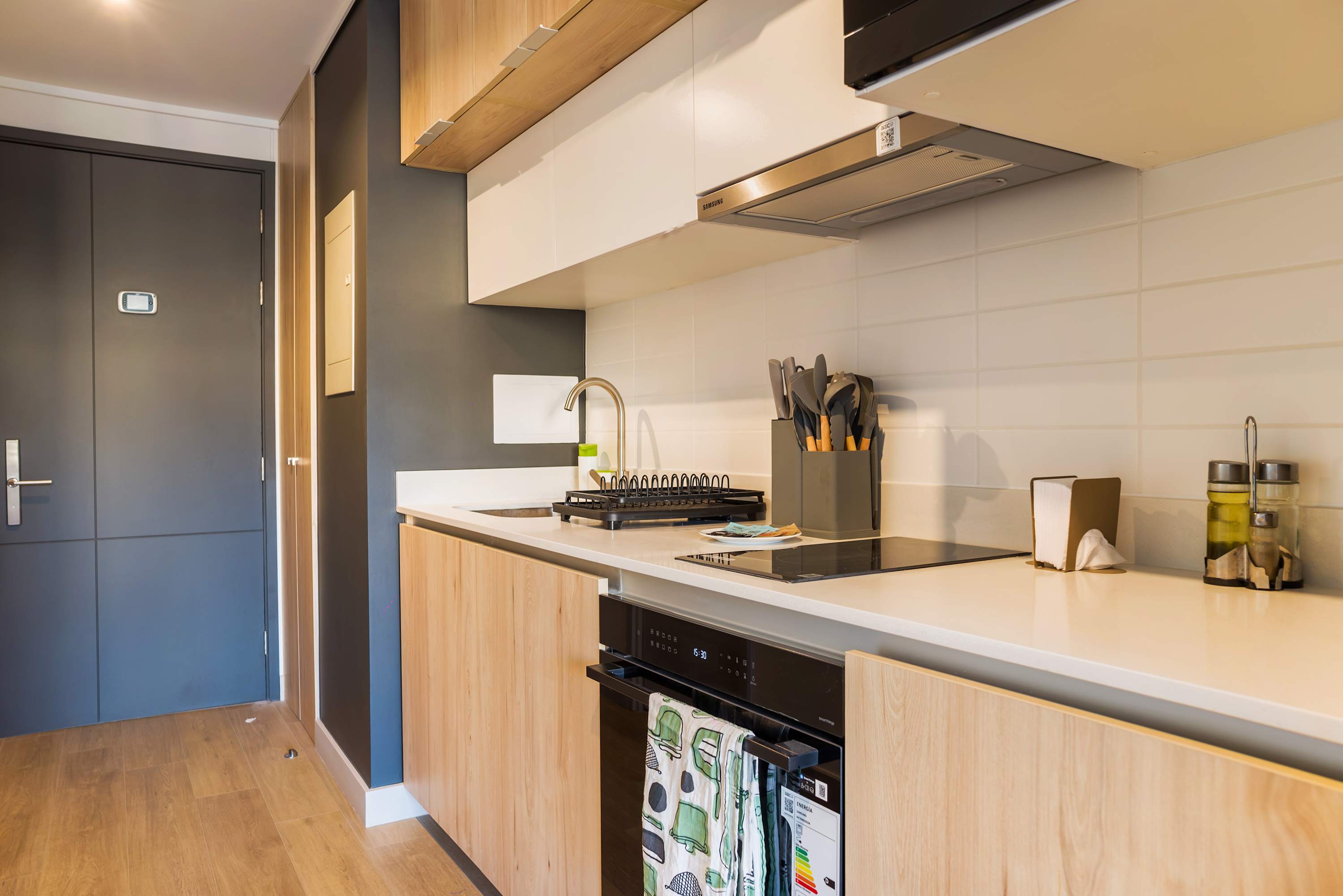 Sleek and modern kitchen with all essentials for a comfortable stay in the heart of the city.
