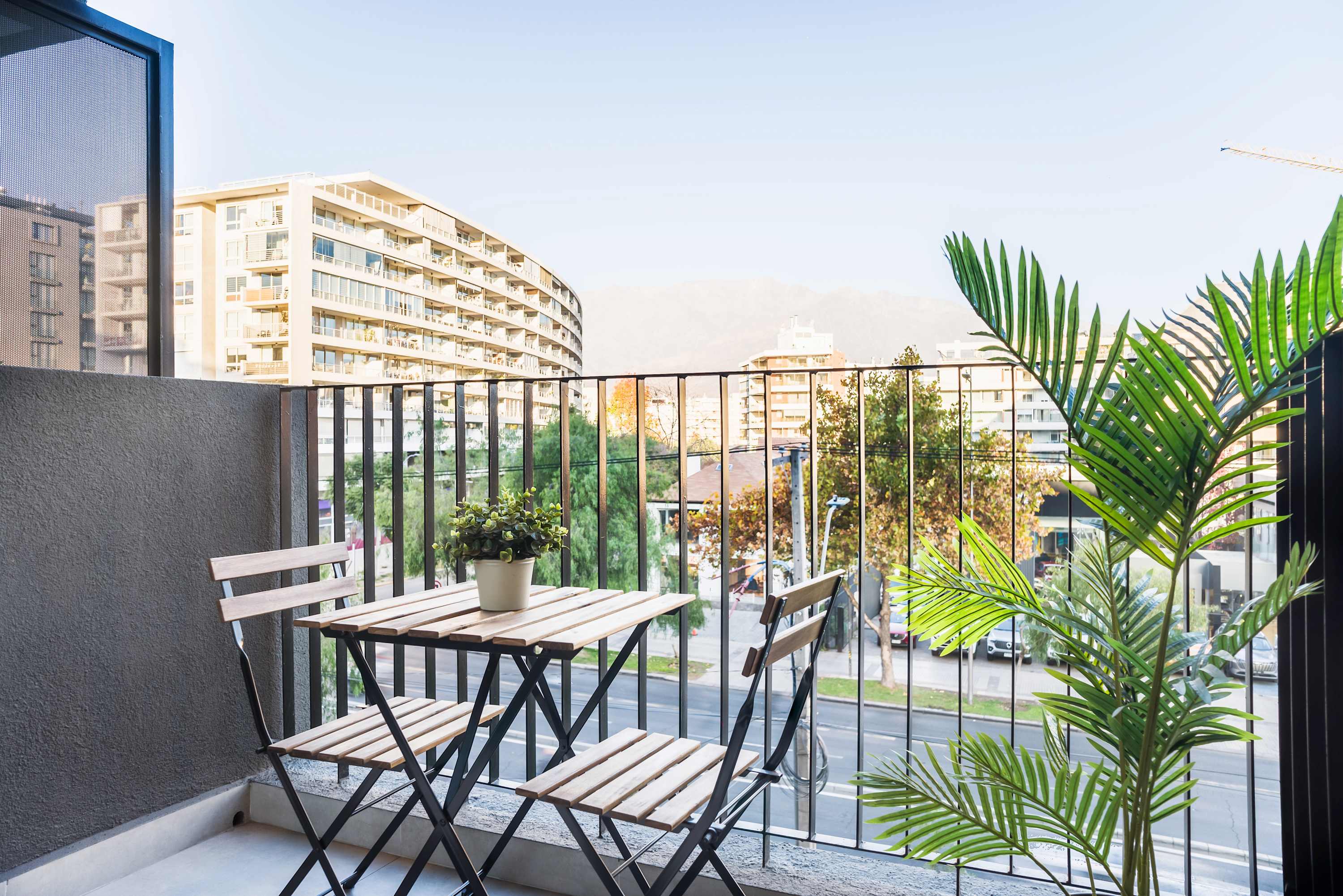 Enjoy a relaxing morning coffee with stunning city and mountain views from your private balcony.