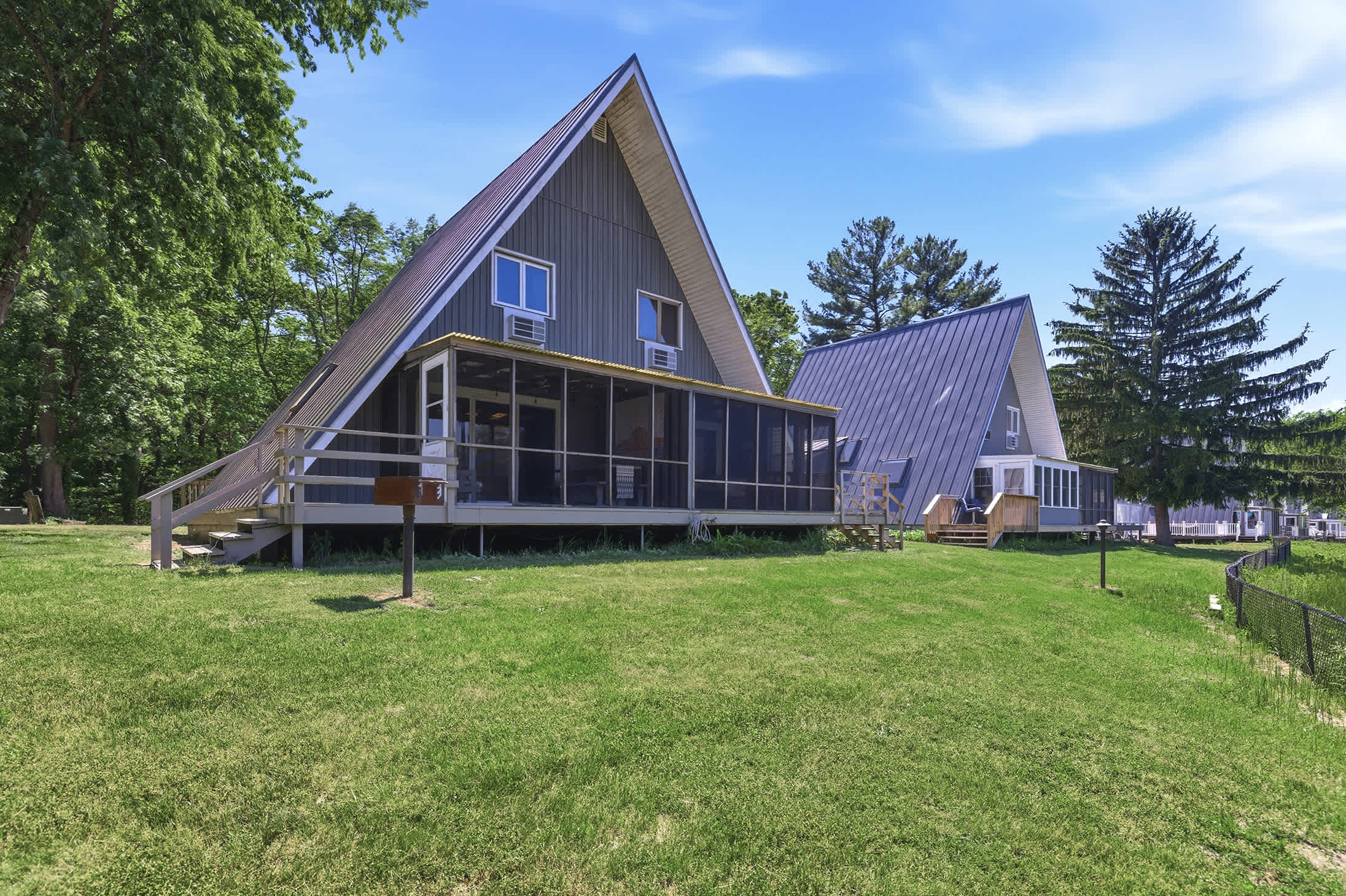 Chalet 94's private screened porch with easy access to resort grounds.