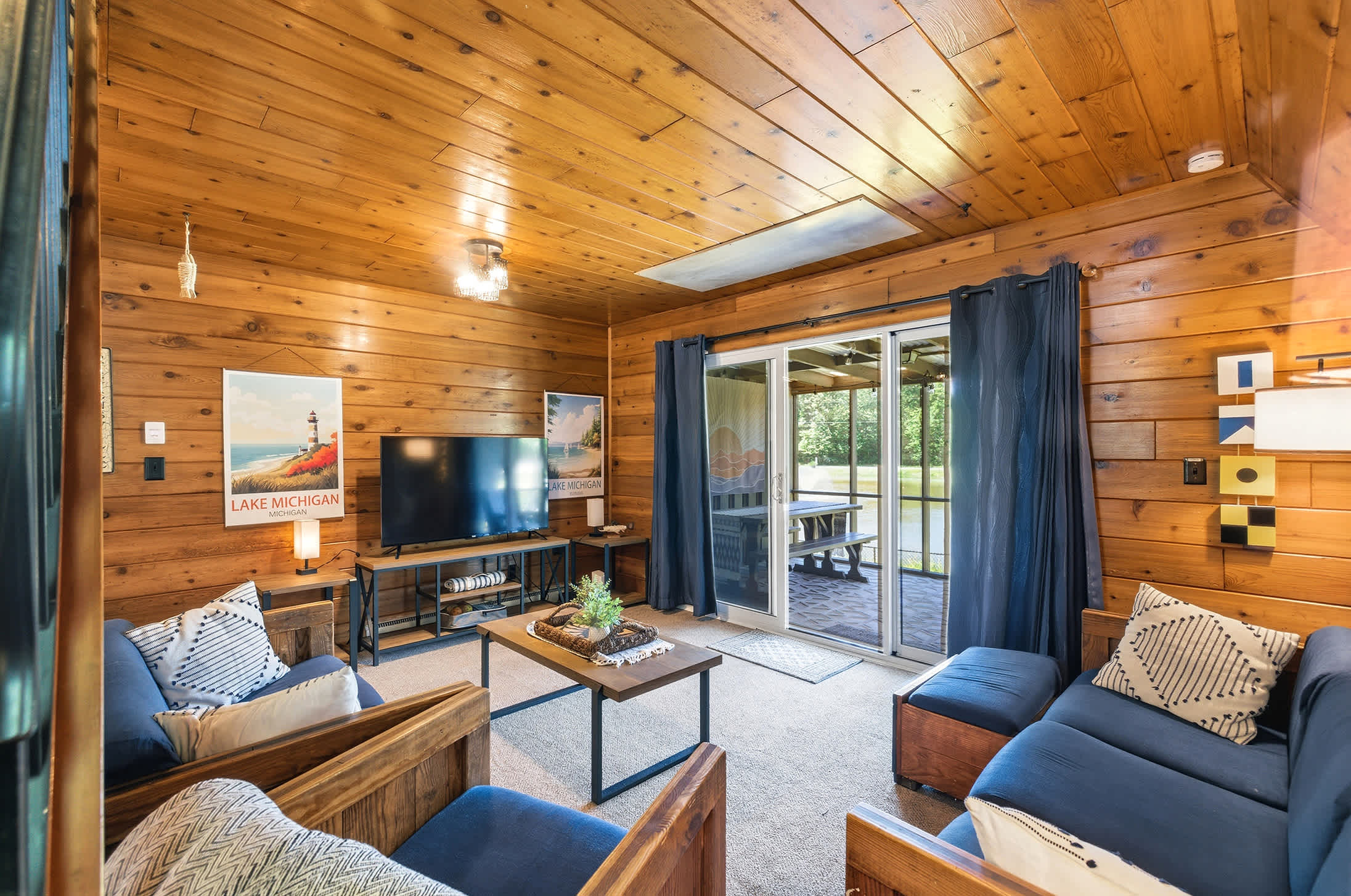 Living room with screened porch access for extended gathering space.