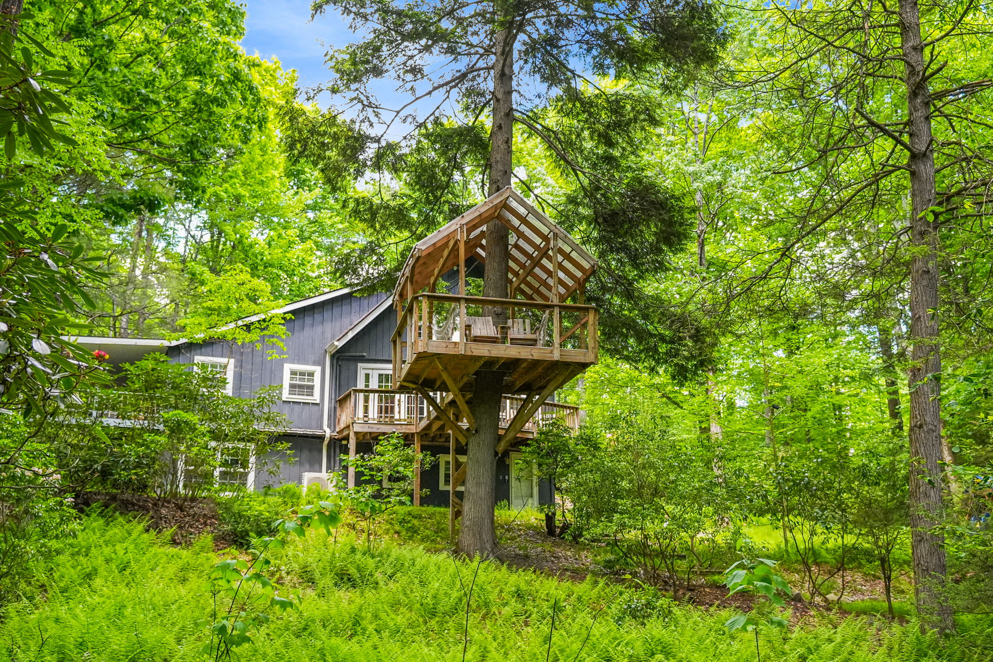 Welcome to your wooded retreat, complete with a charming tree house for fresh-air escapes.