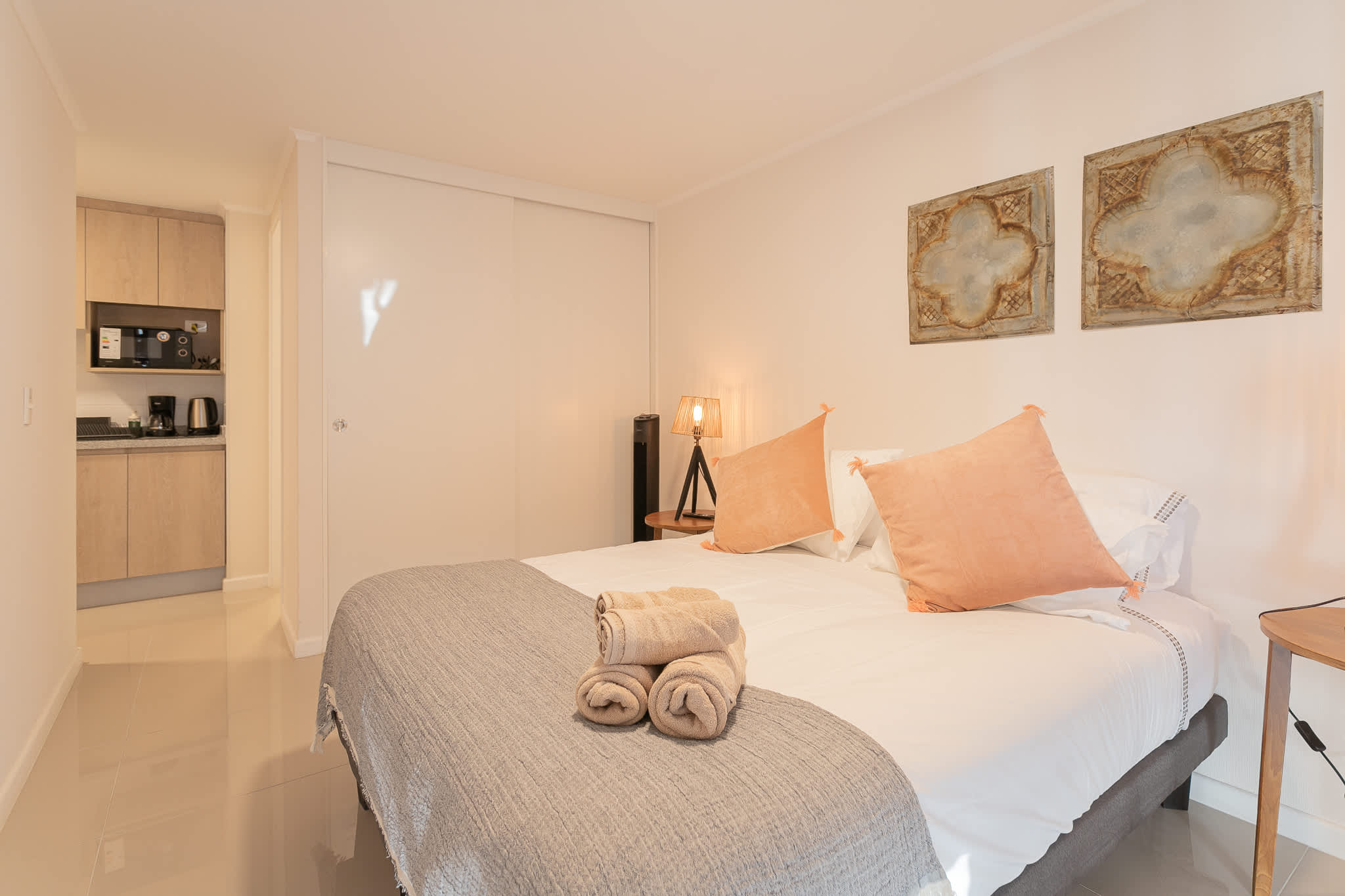 Relax in this cozy studio with a comfy bed, modern kitchenette, and warm decor—perfect for a peaceful stay.