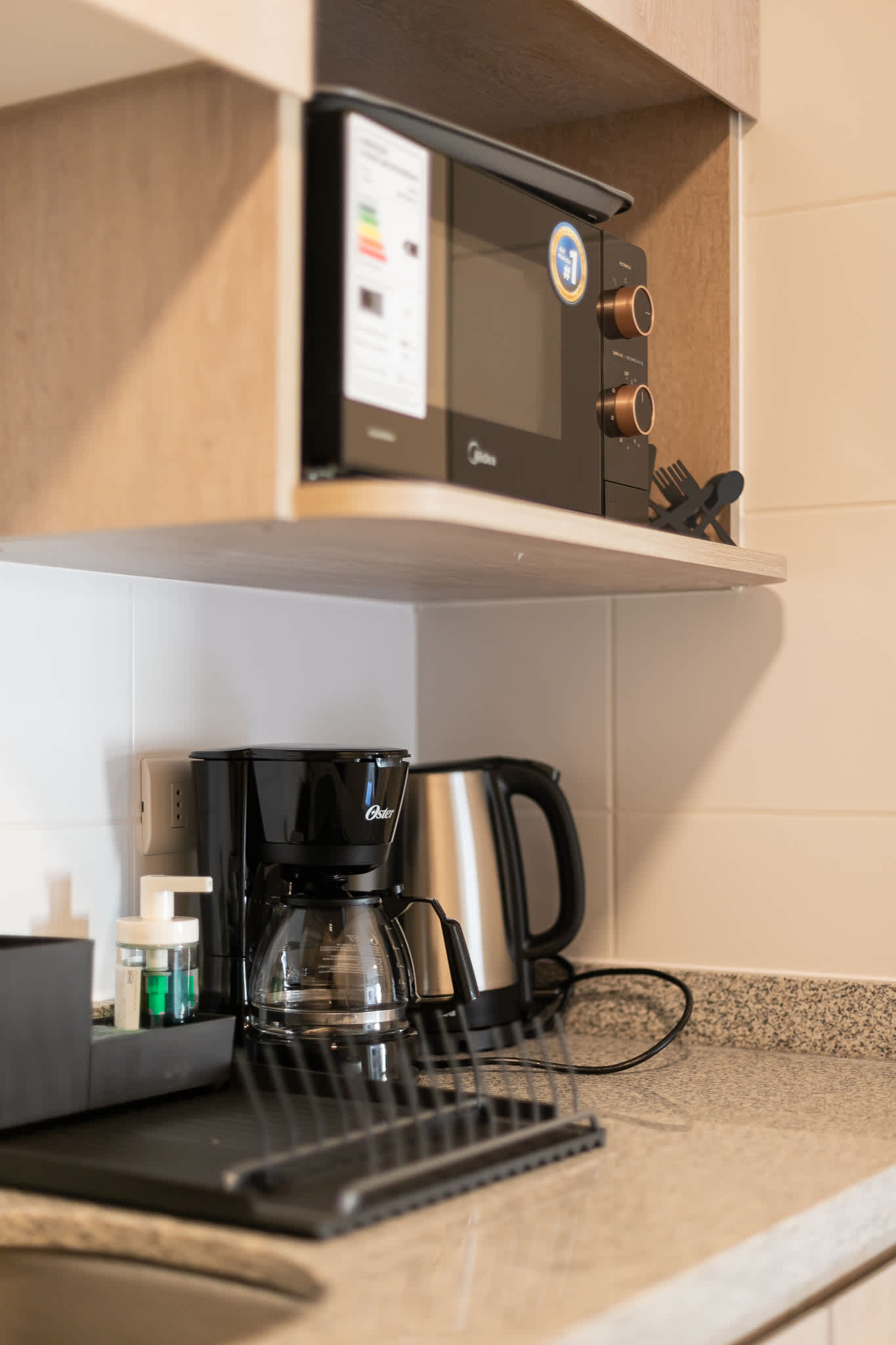 Compact kitchen with essential appliances for a convenient stay.