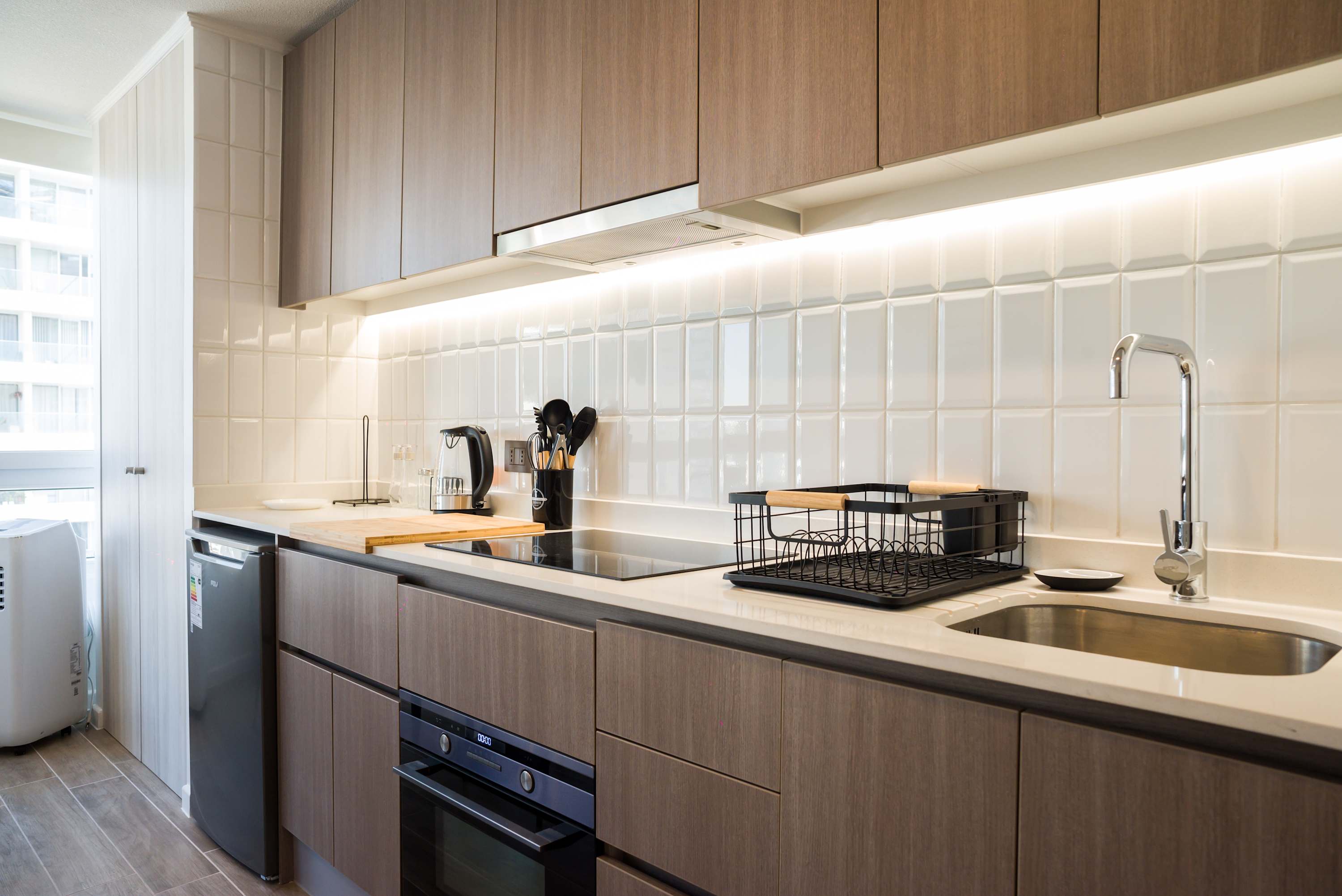 Sleek and modern kitchen with all essentials for a comfortable stay in the heart of the city.