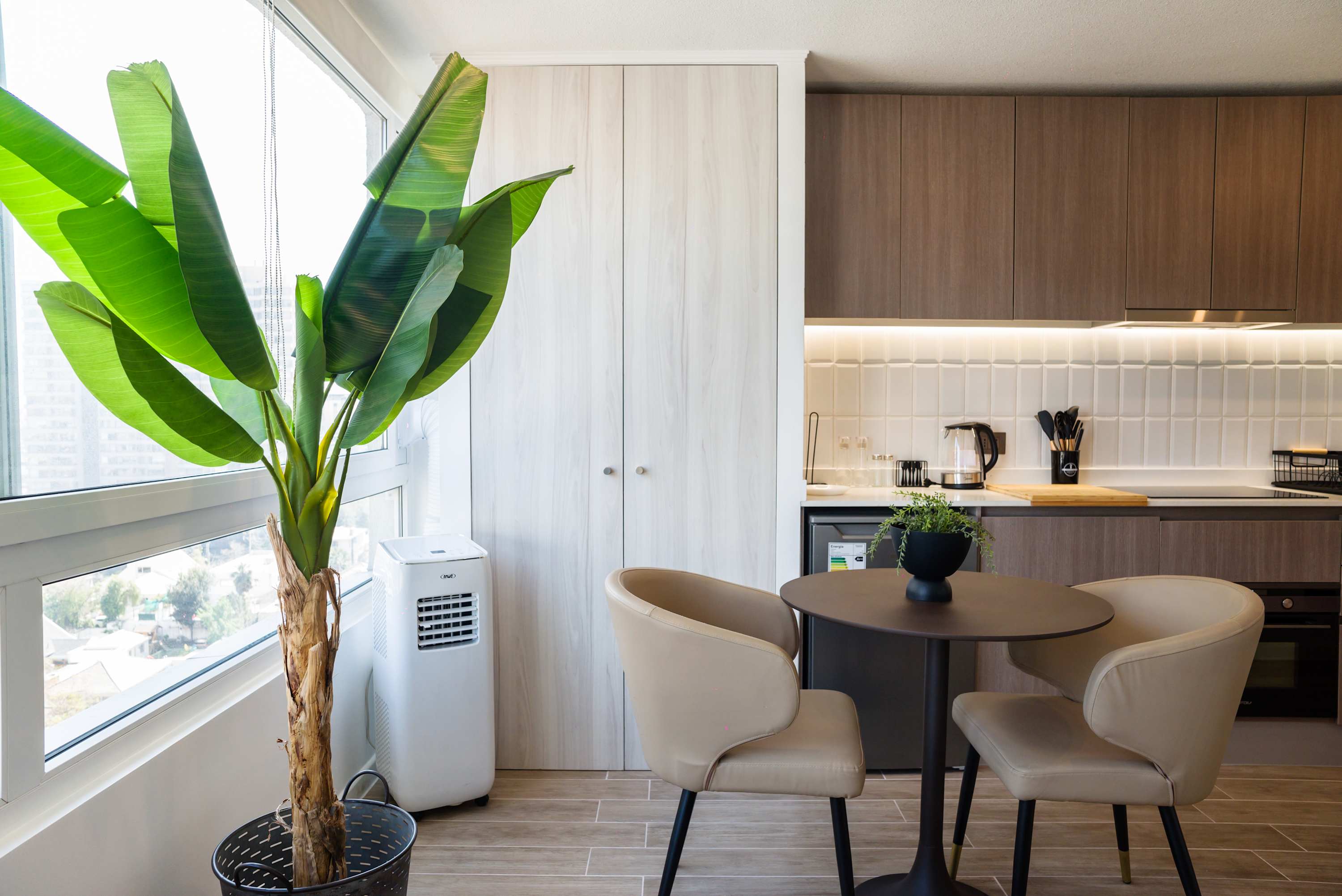 Cozy kitchen with modern amenities and a bright, airy feel, perfect for intimate meals.