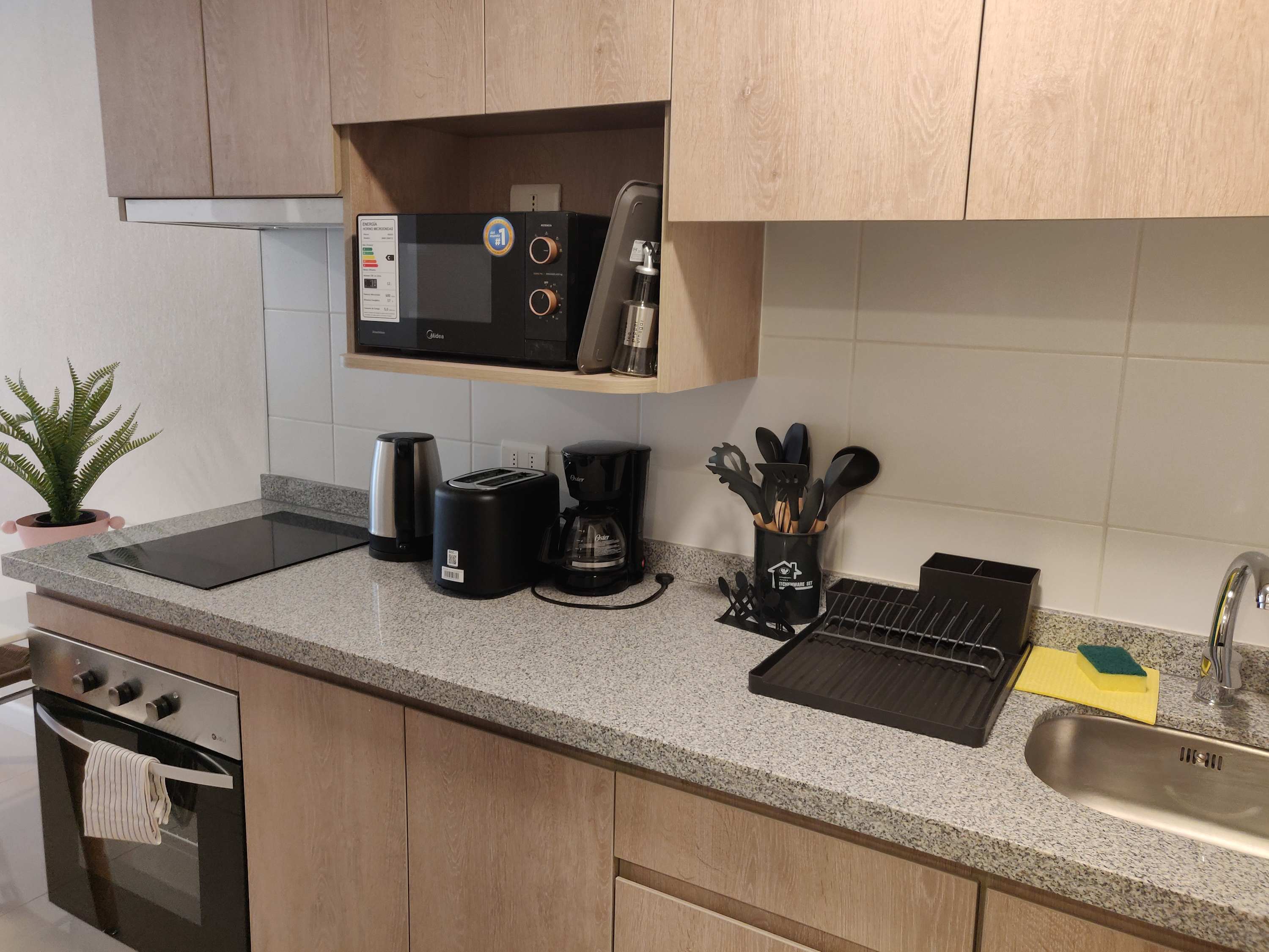 Modern and fully-equipped kitchen with all essentials for a comfortable stay in the heart of the city.