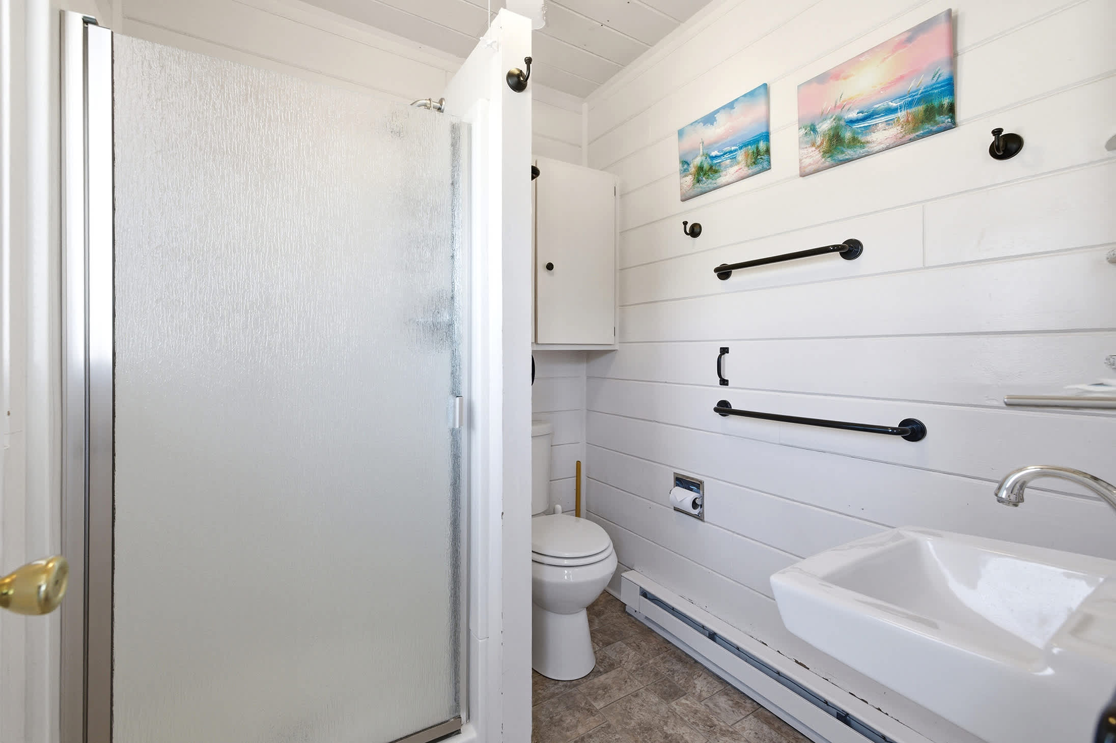 Refresh after the beach with a full bath and walk-in shower.