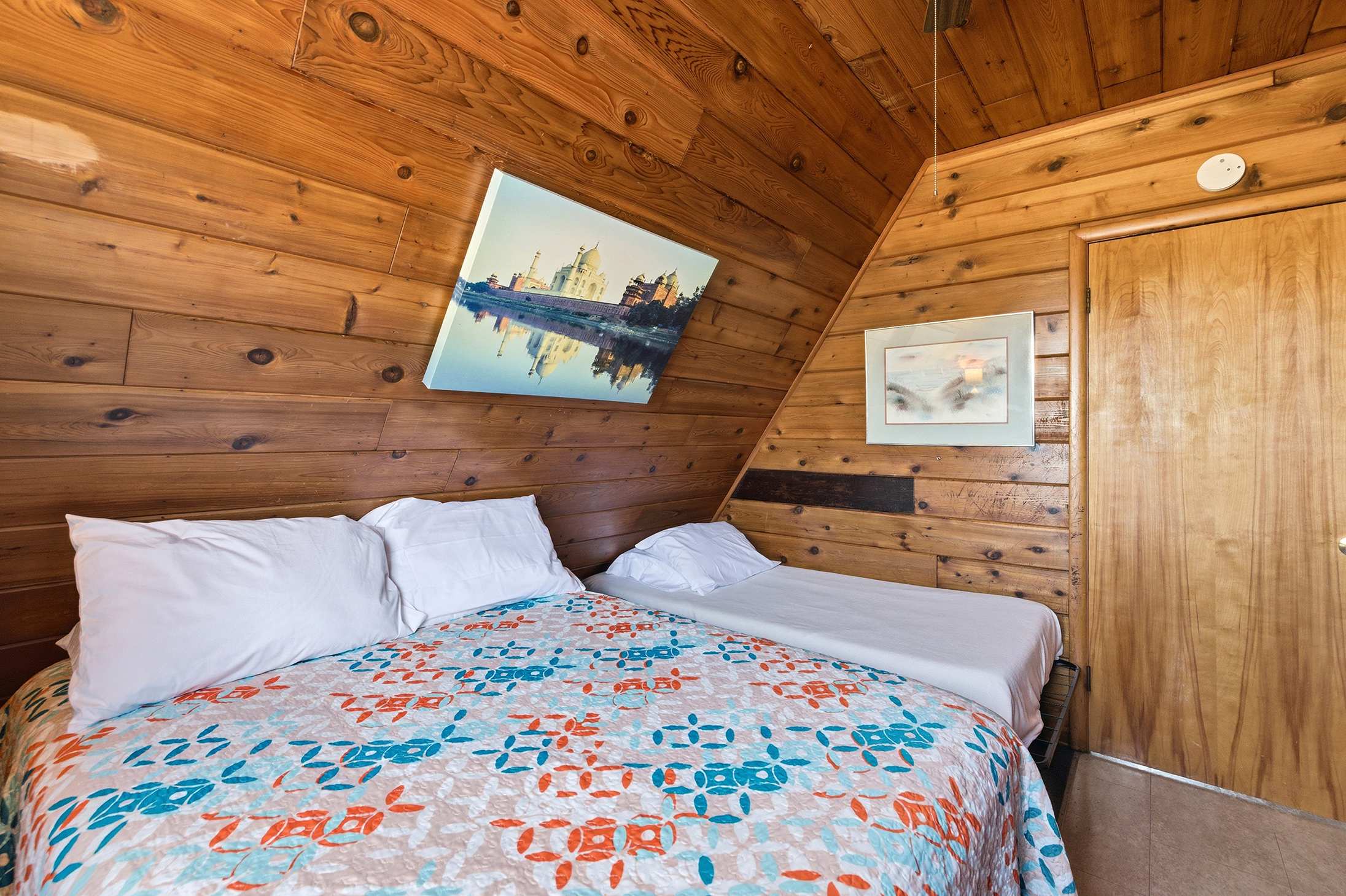 Bedroom 1 with mixed bedding helps keep families comfortably together.