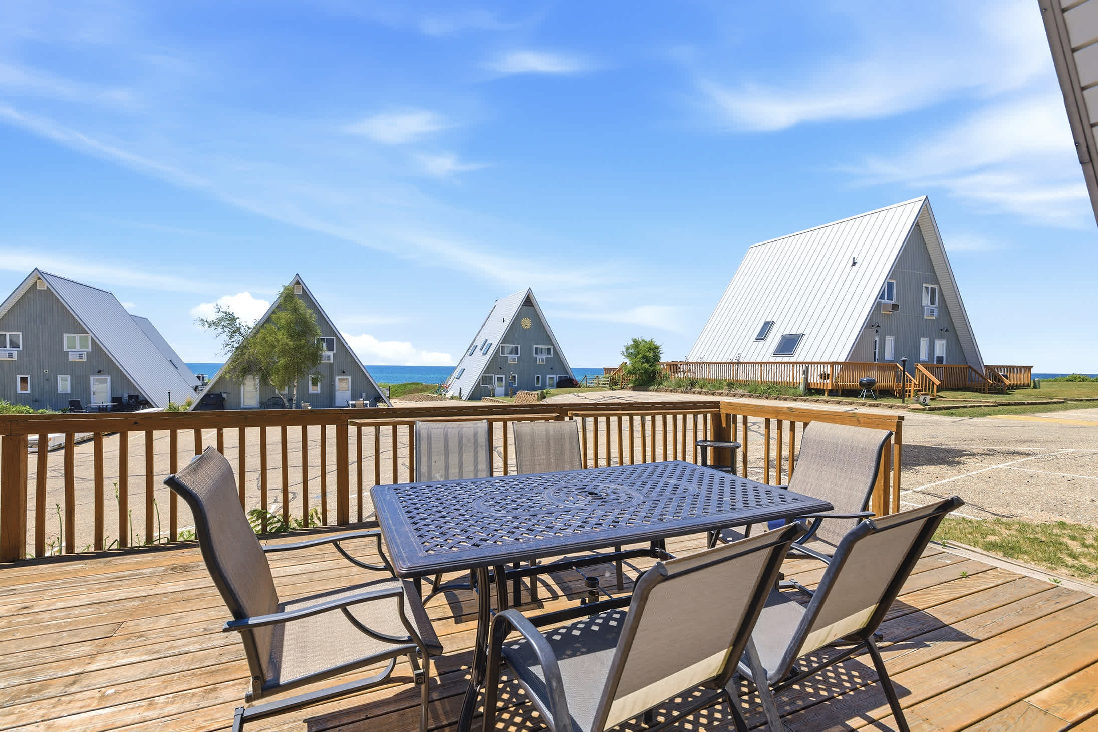 Outdoor dining space steps from the shoreline and resort amenities.
